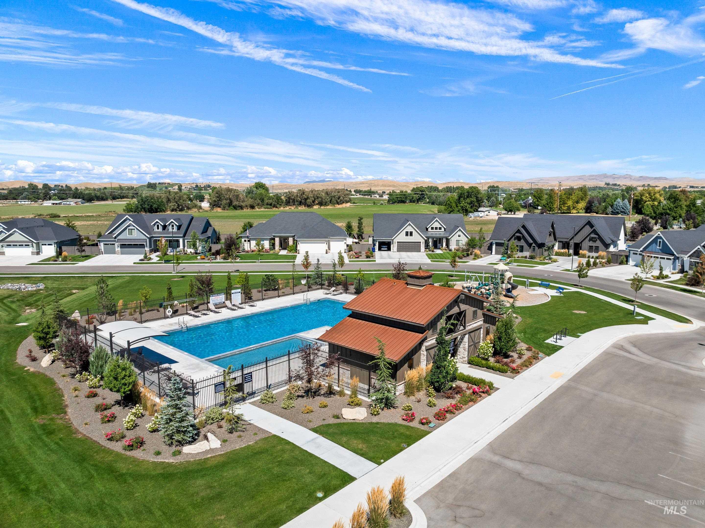 Community pool with a residential view and a patio area