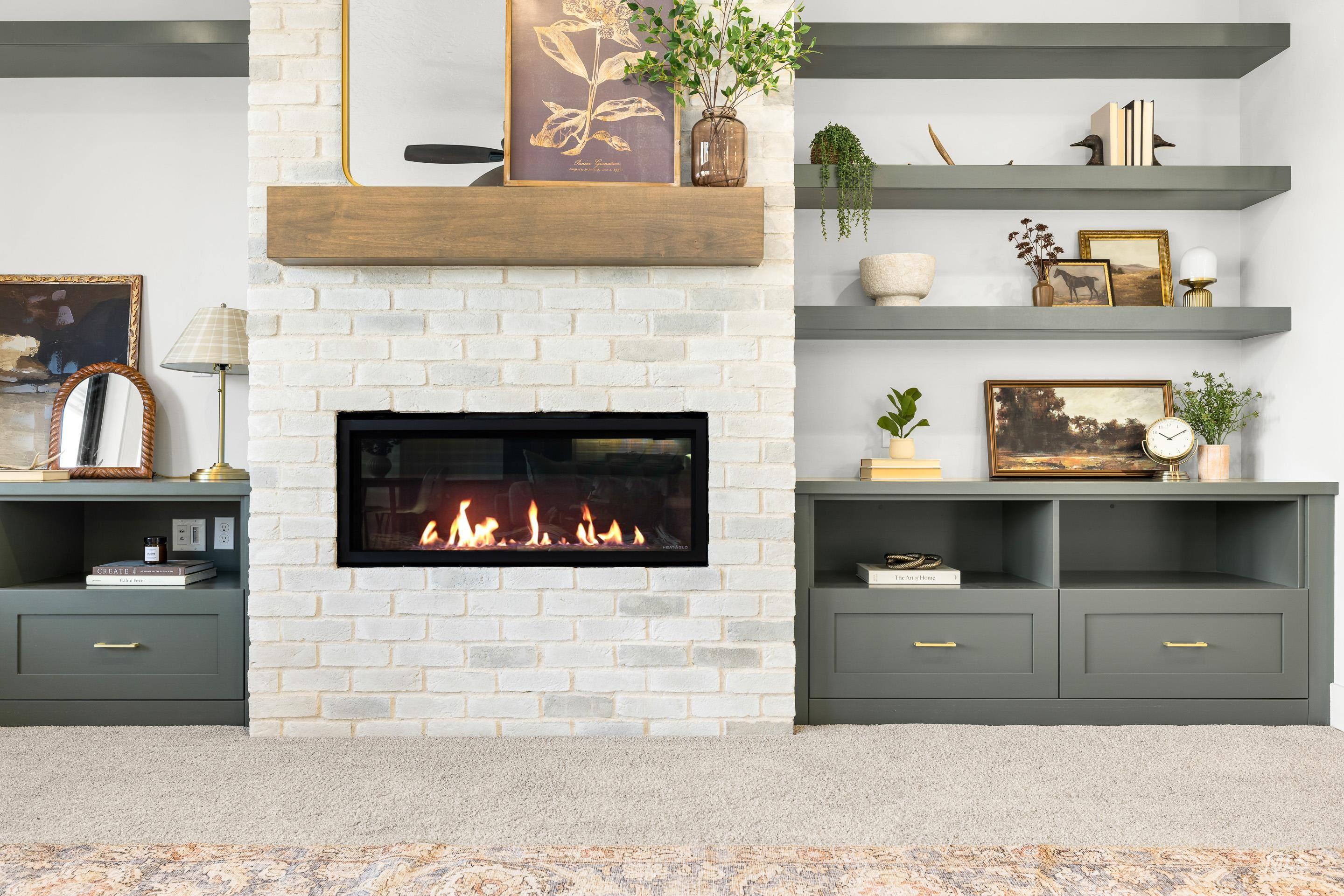 Detailed view of a brick fireplace and carpet