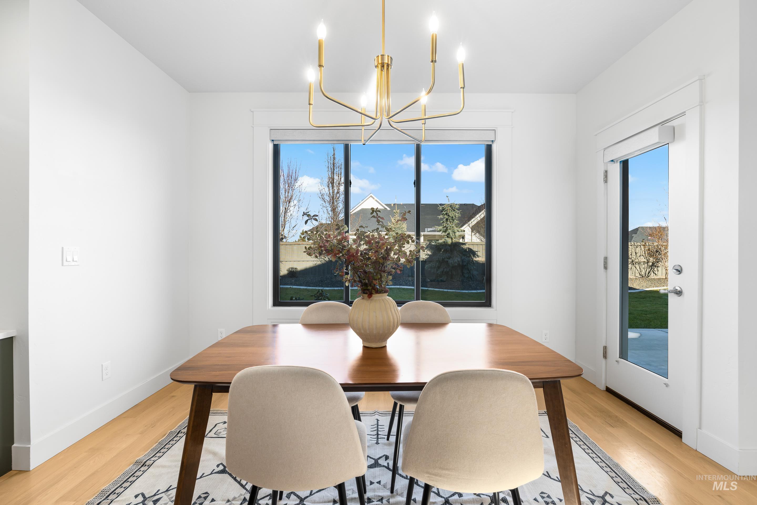 Dining space featuring a chandelier and light wood-style floors