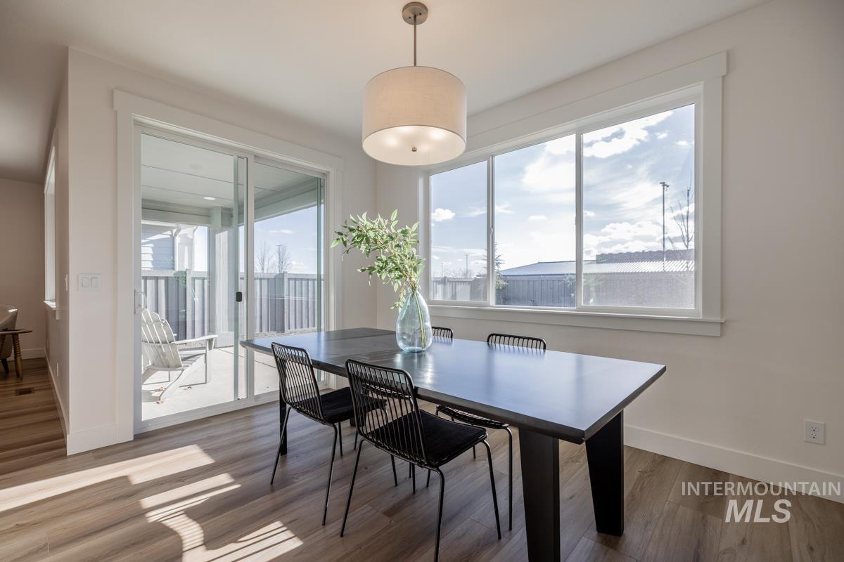 Dining area with wood finished floors and baseboards