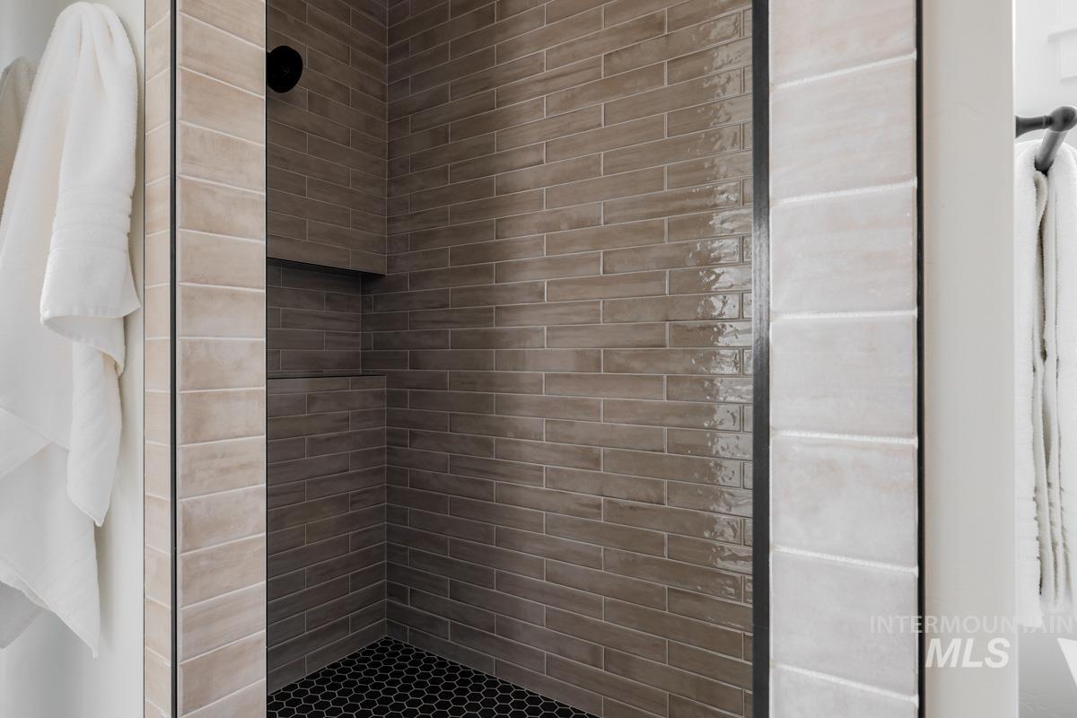 Bathroom featuring a shower stall