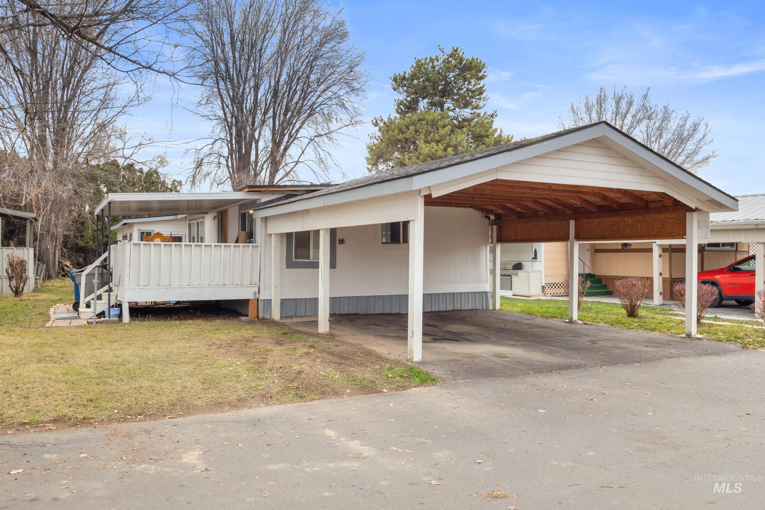 View of car parking with asphalt driveway