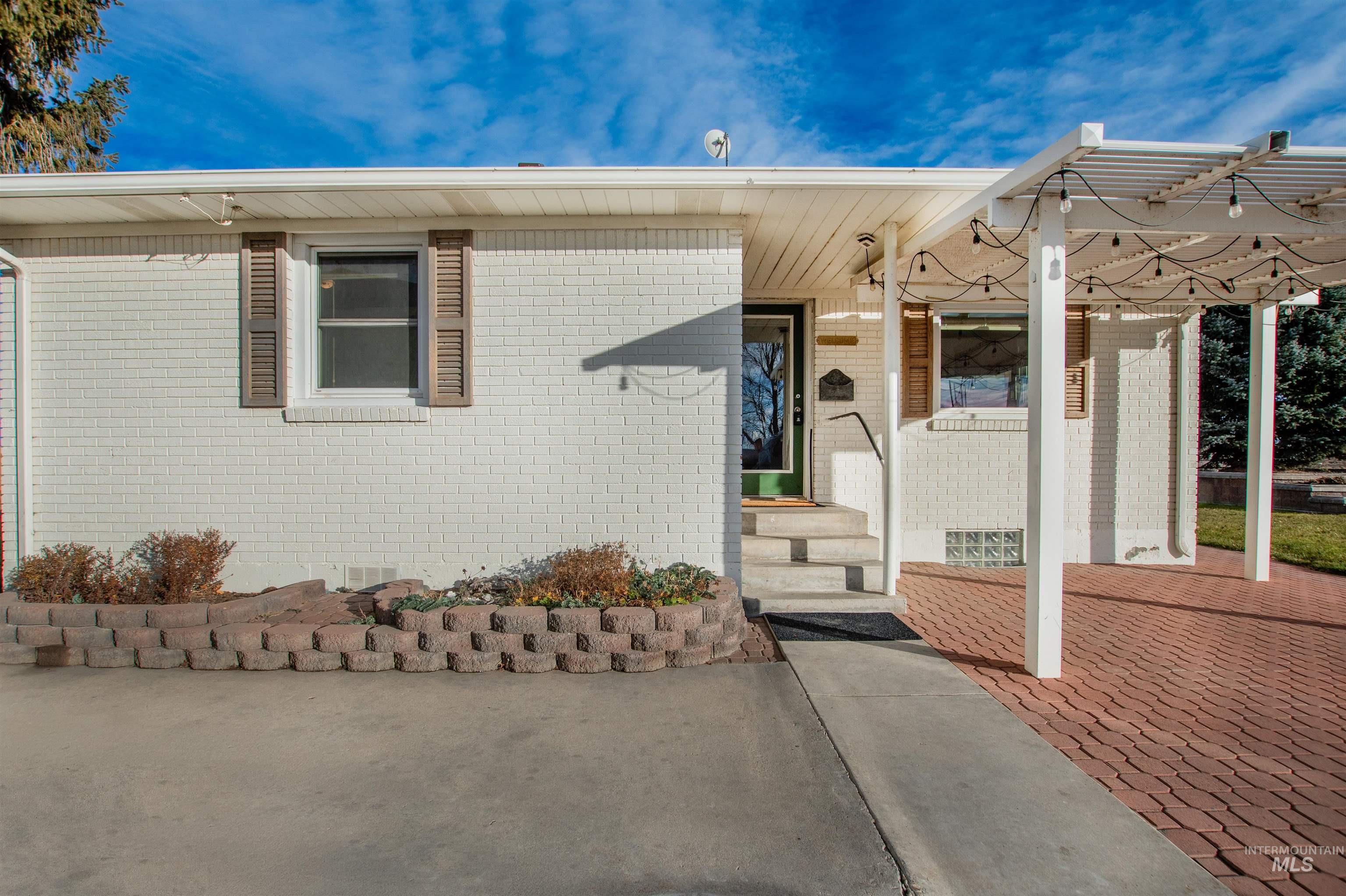View of front of house featuring brick siding