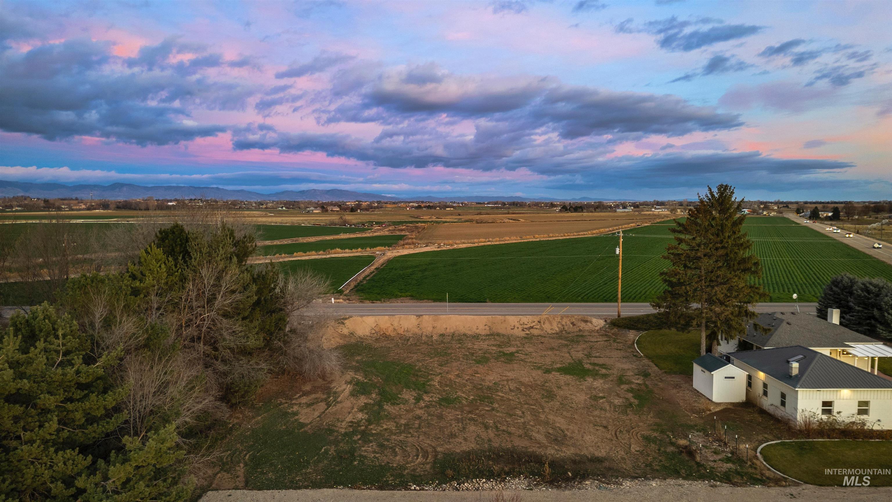 Aerial view at dusk of a view of rural / pastoral area and agricultural plots