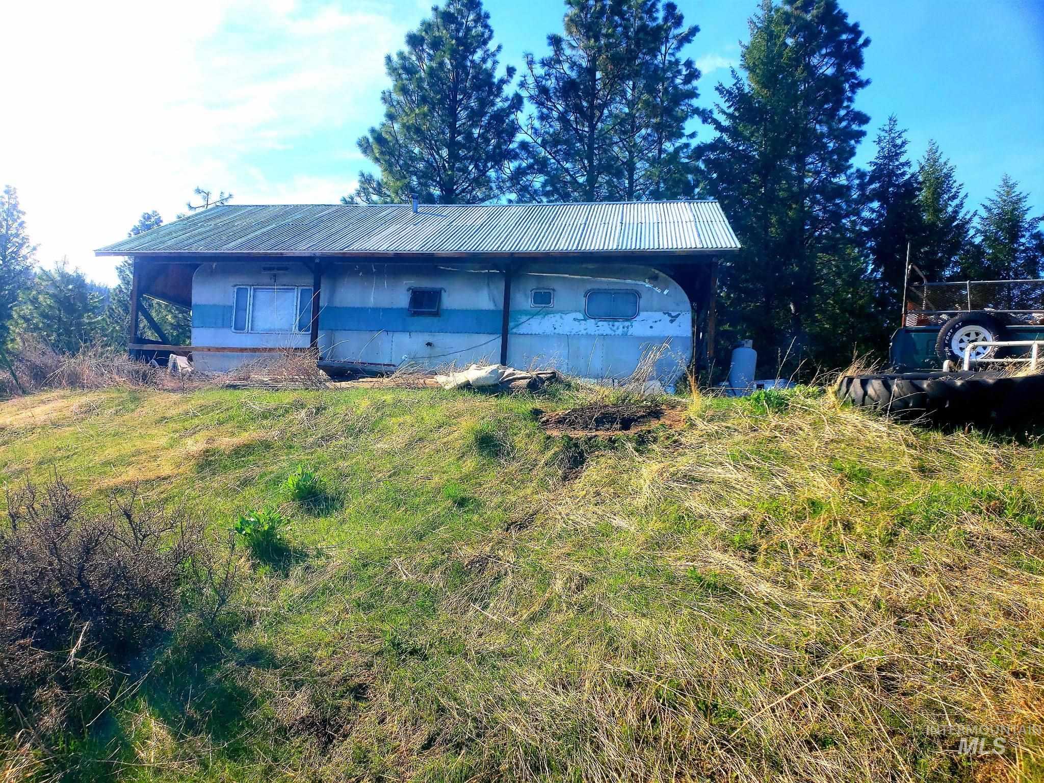 View of property exterior with a metal roof