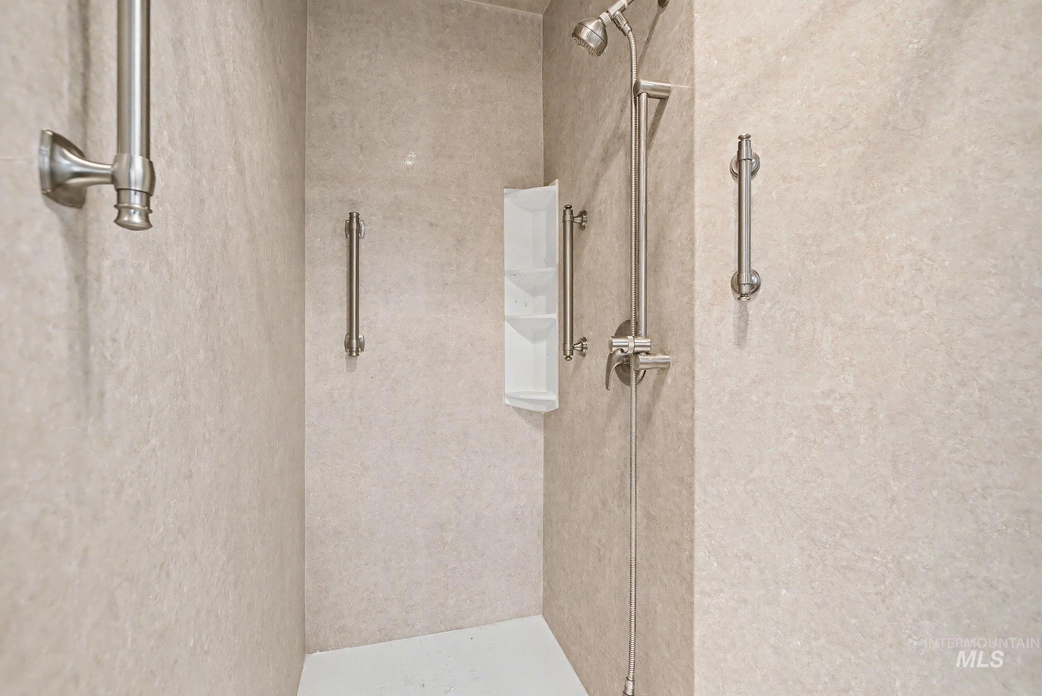 Full bath with a shower stall