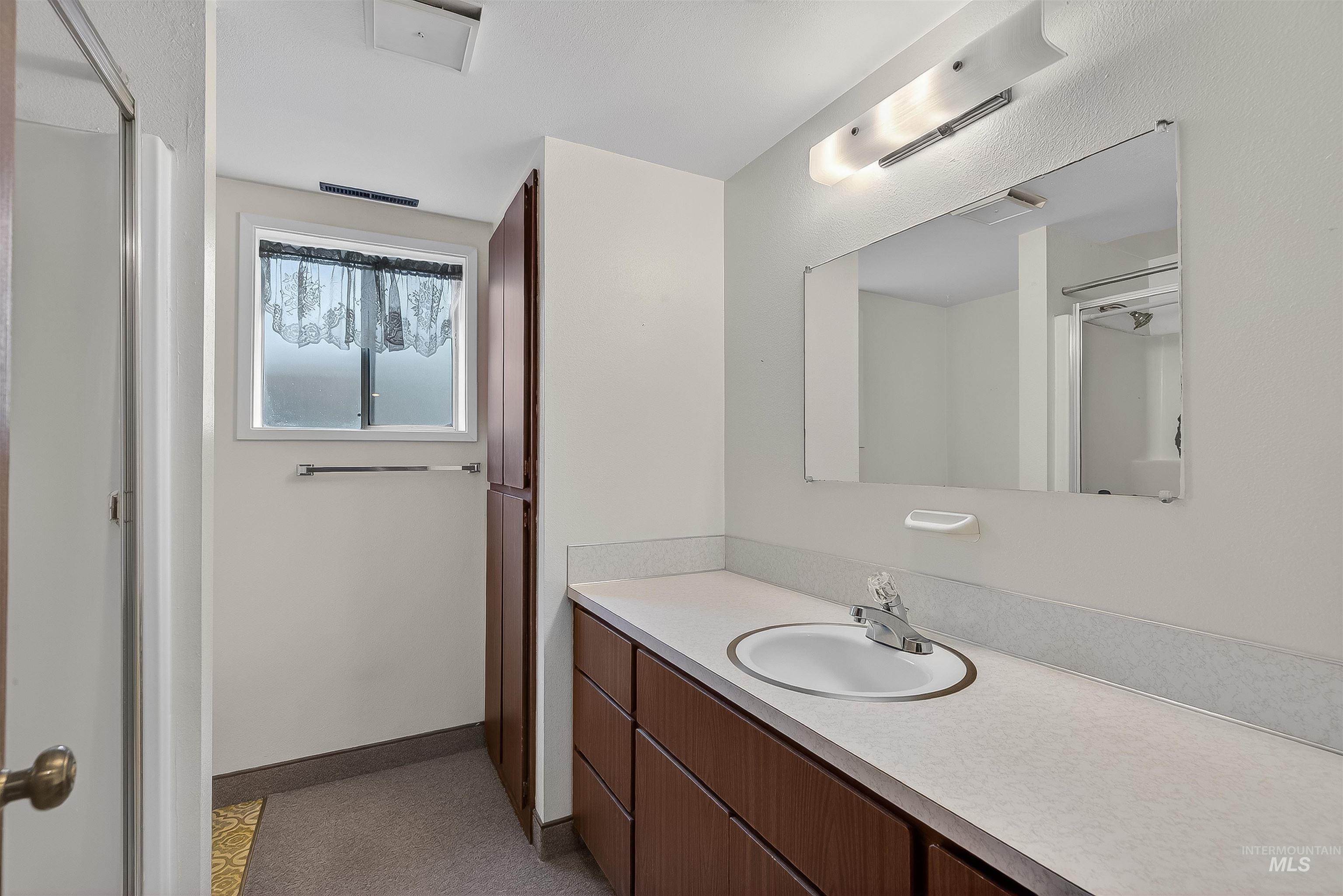 Bathroom featuring vanity