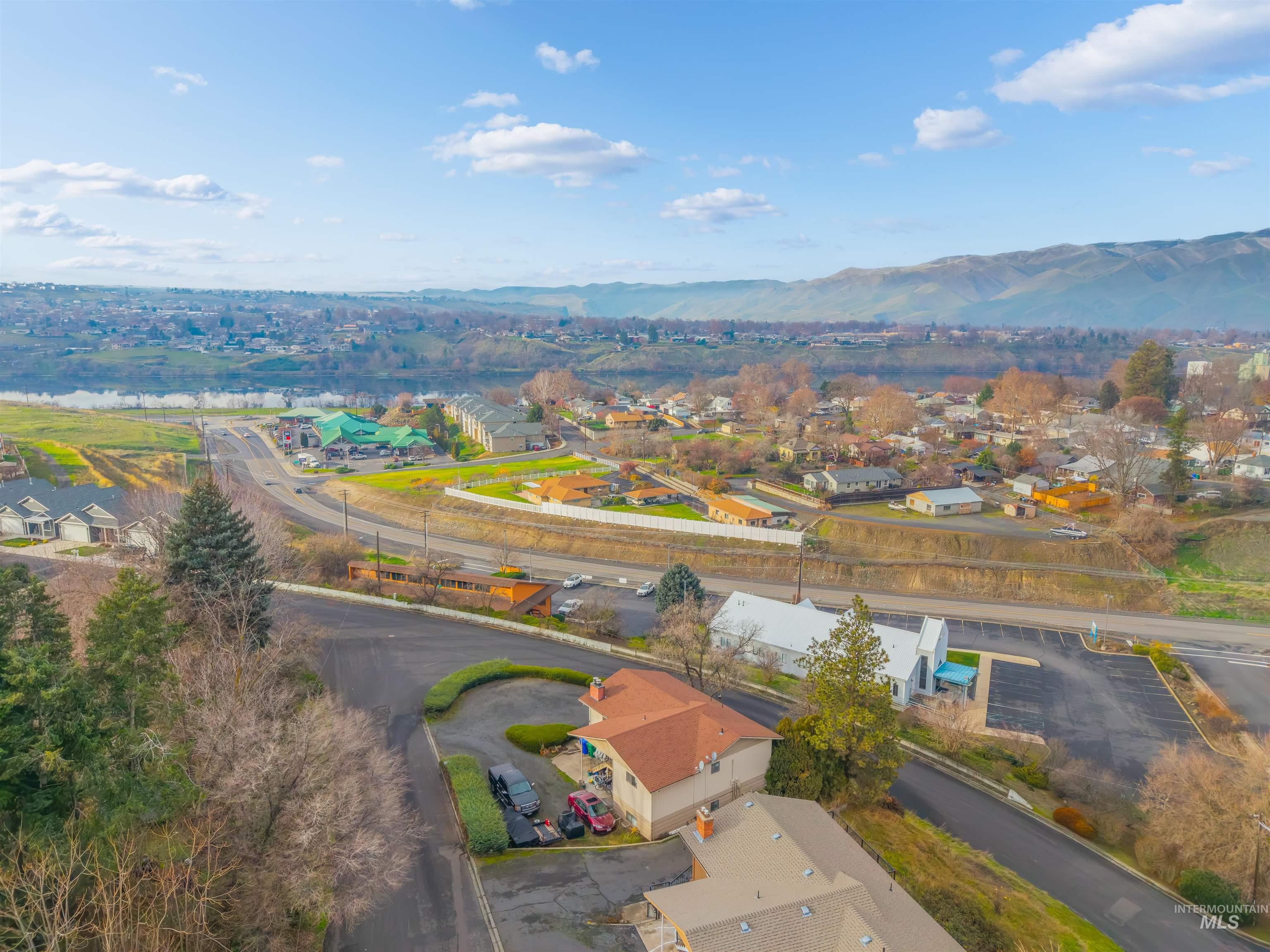 Aerial view of residential area featuring a mountain backdrop