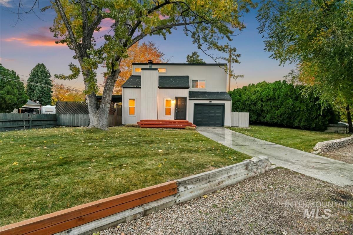 Contemporary house with concrete driveway and an attached garage