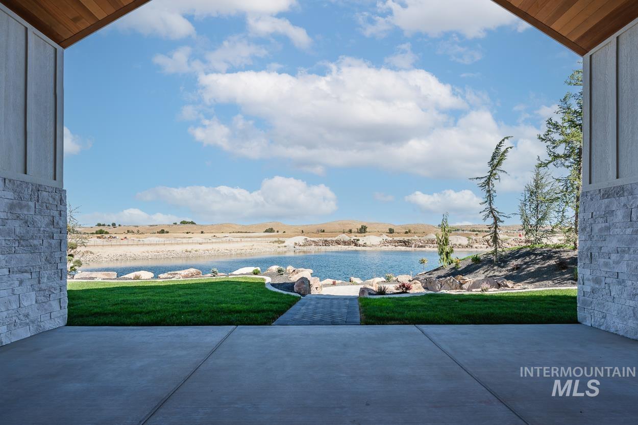 View of patio with a water view