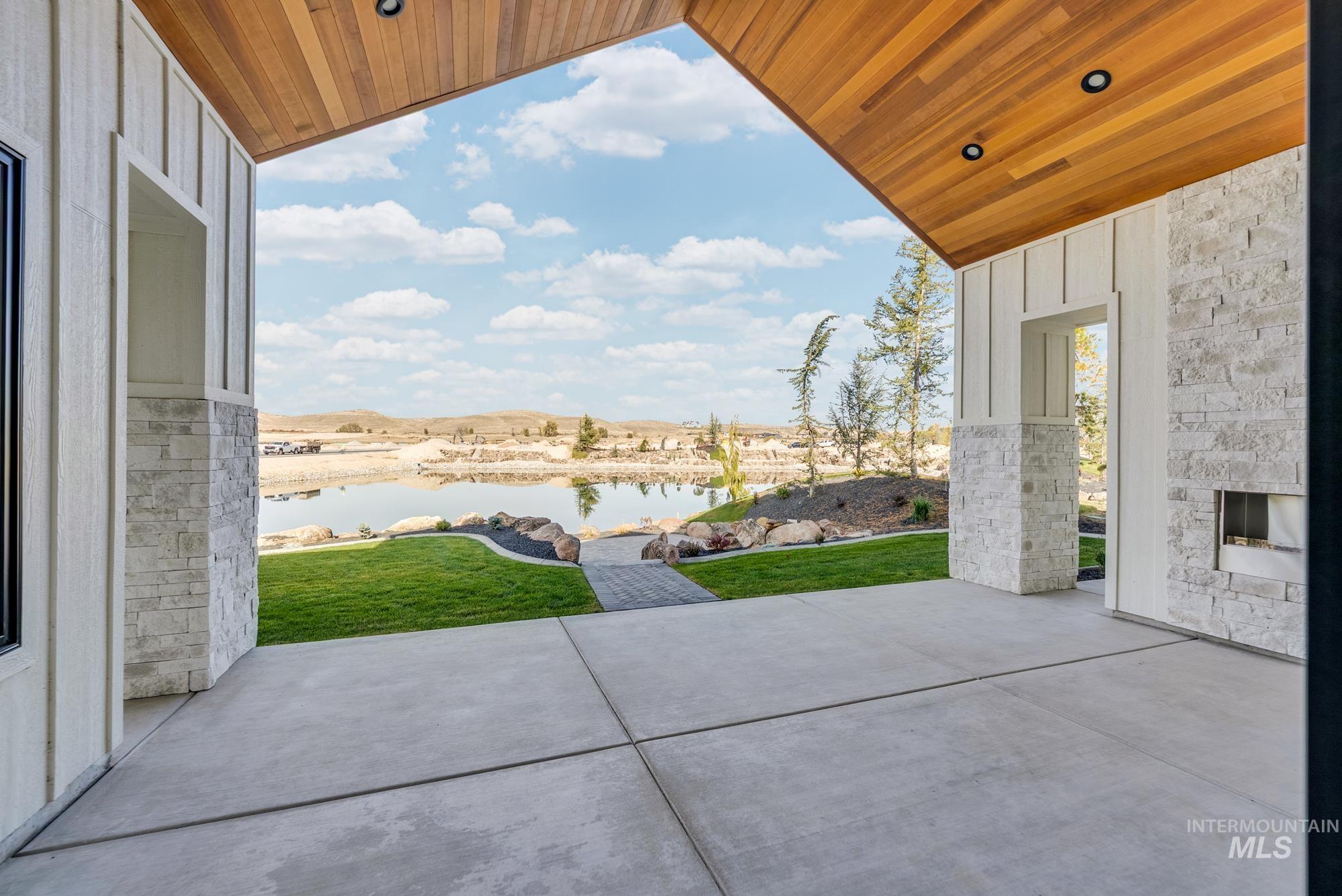 View of patio with a water view