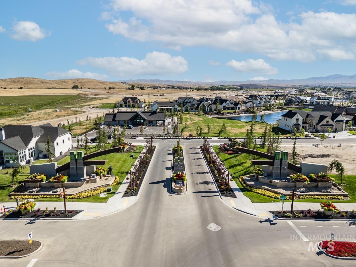 Aerial view of residential area featuring a large body of water