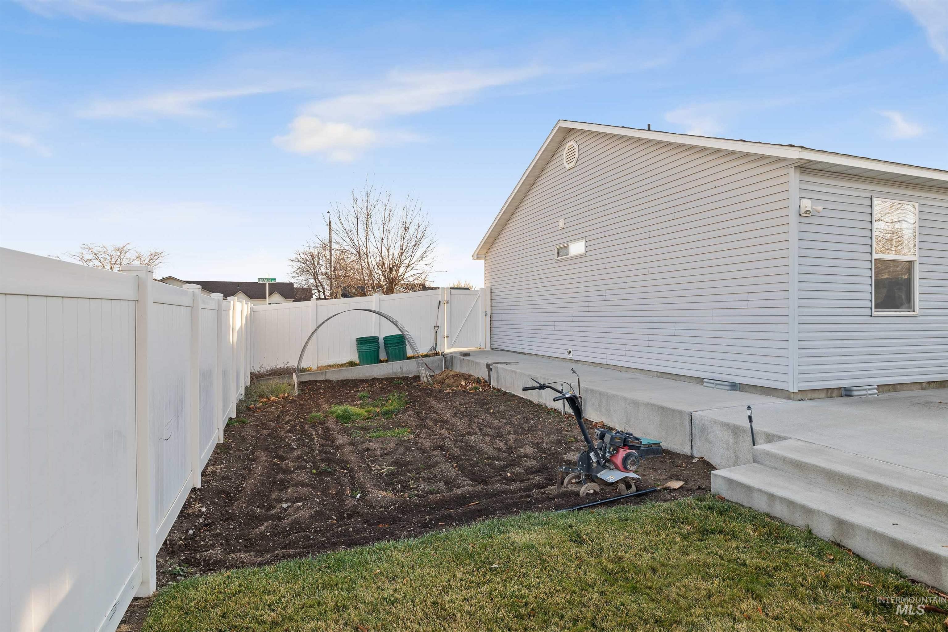 View of side of property with a fenced backyard