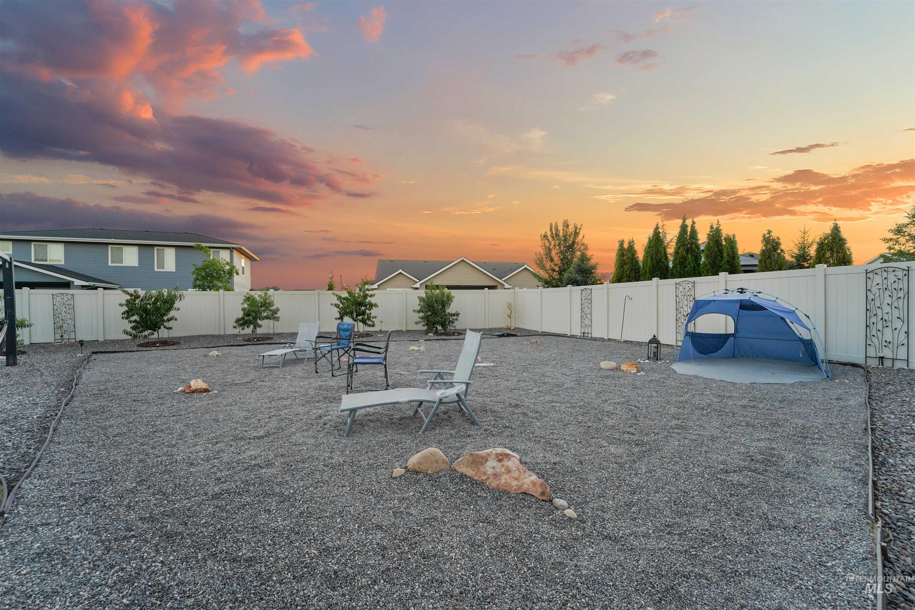 Fenced backyard with a patio