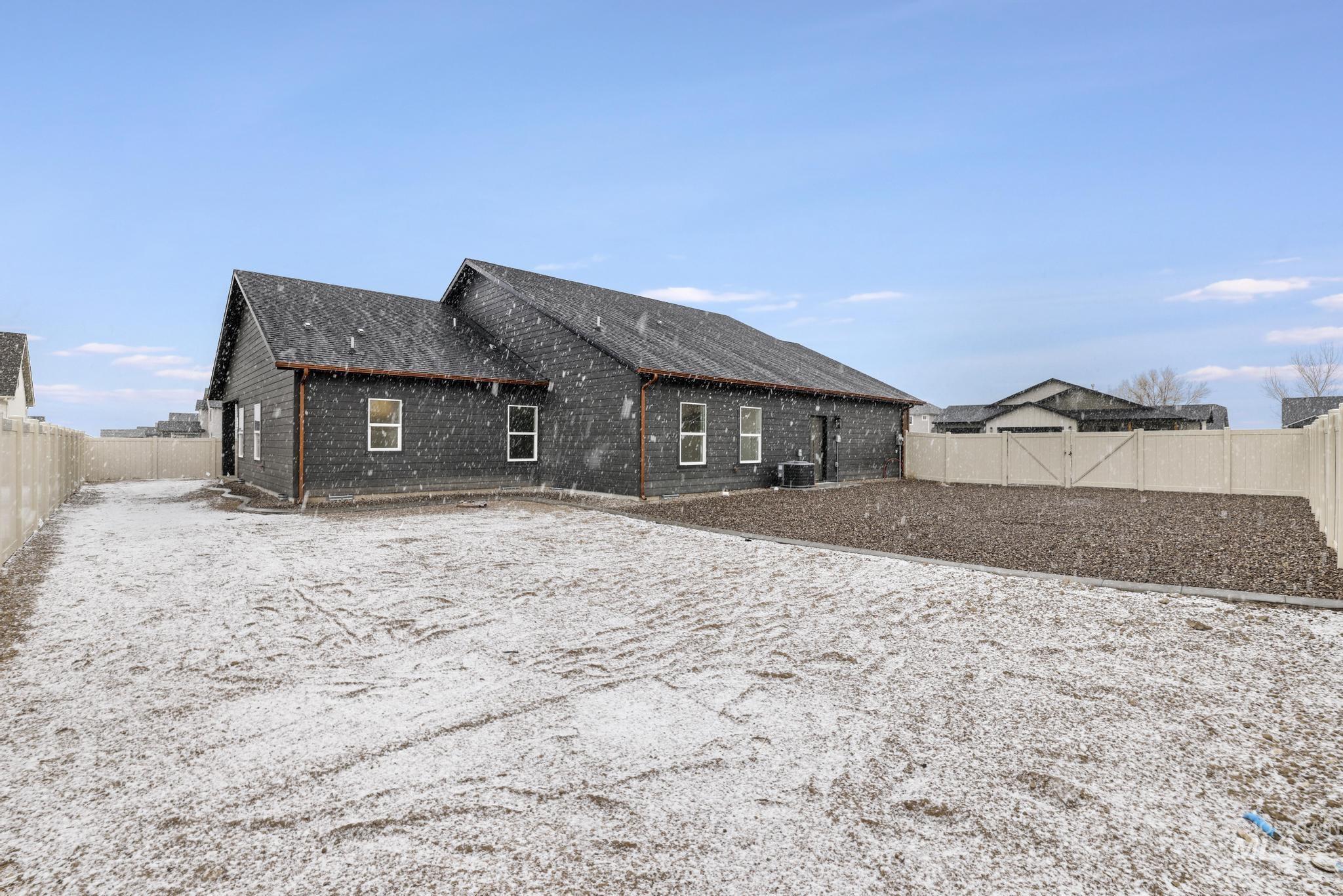 Back of house featuring a fenced backyard