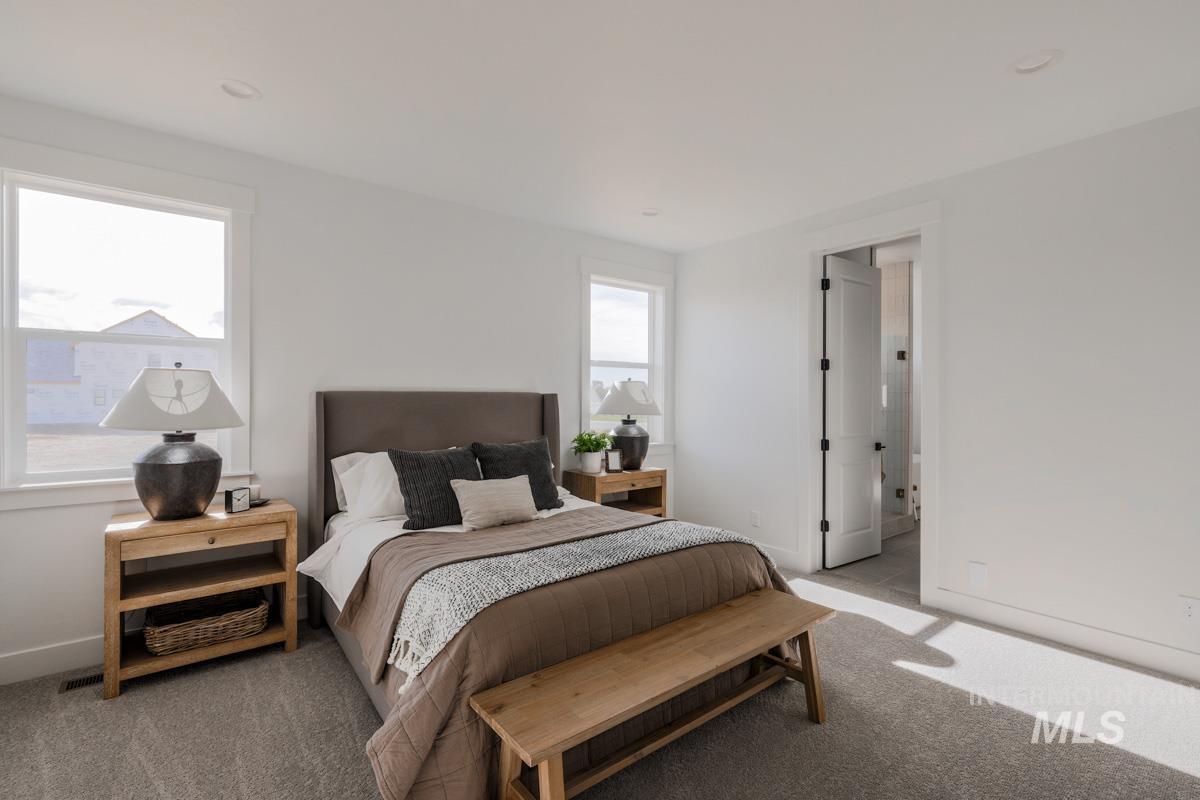 Carpeted bedroom with baseboards and recessed lighting