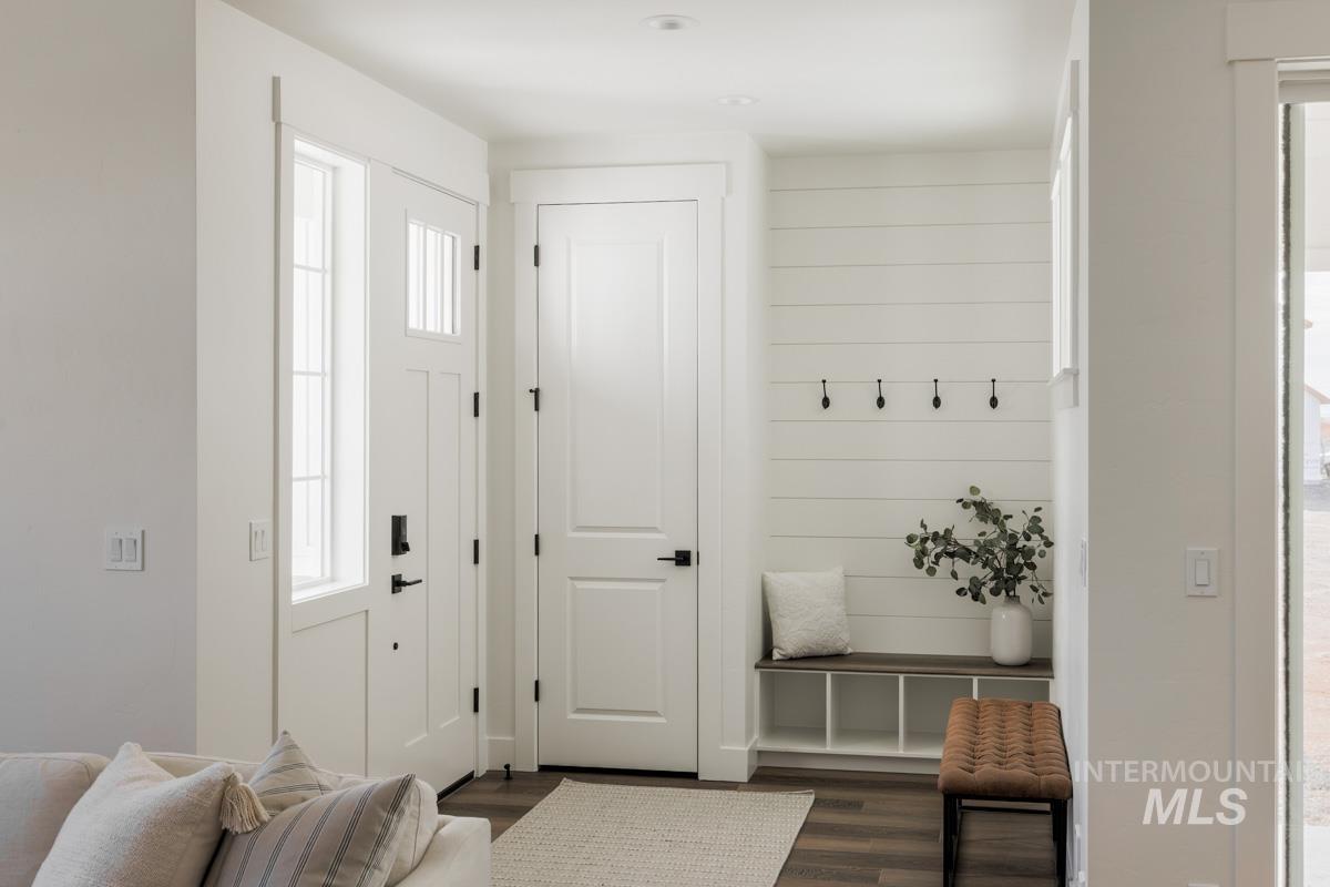 Mudroom with dark wood-type flooring