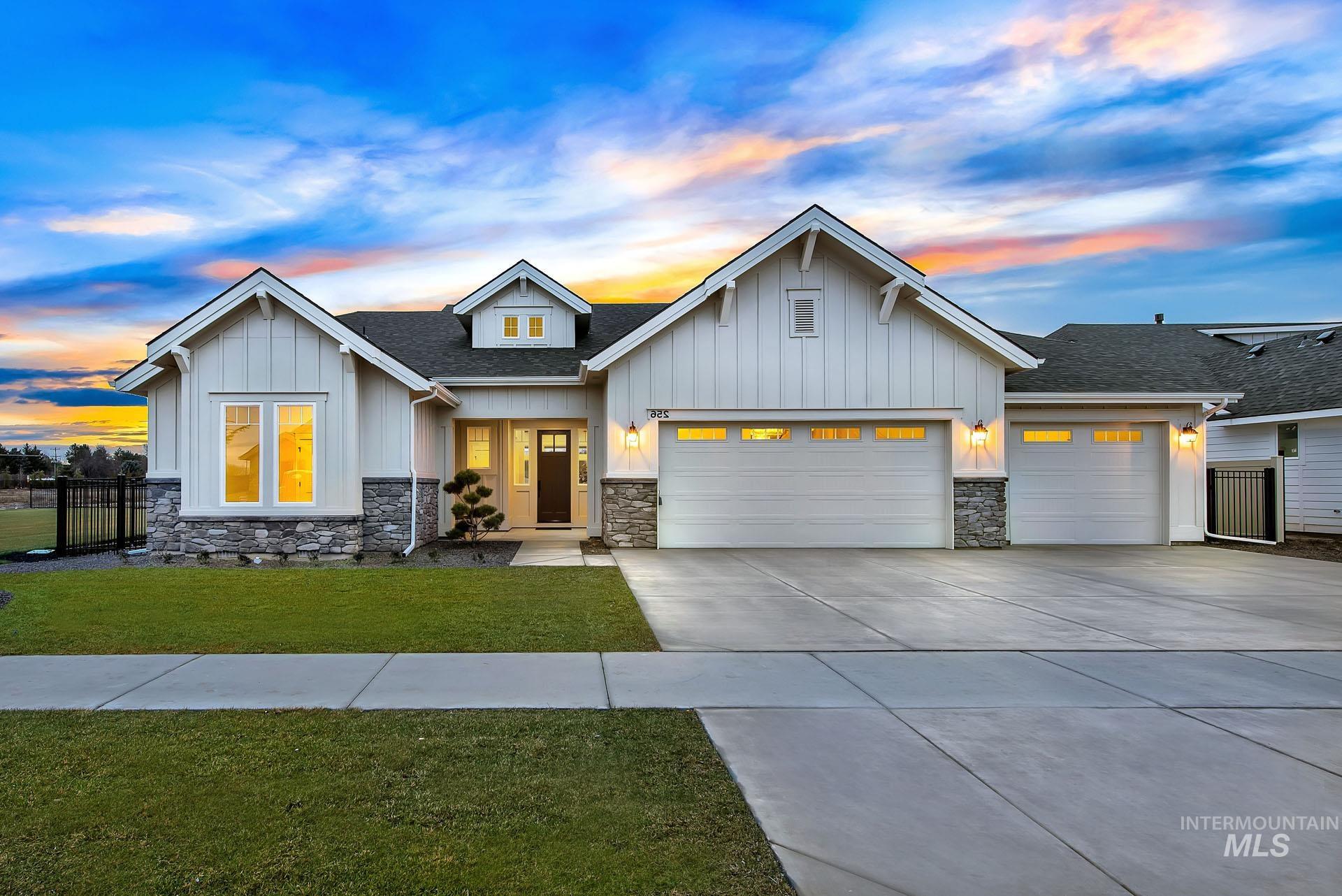 Modern farmhouse style home with board and batten siding, an attached garage, roof with shingles, concrete driveway, and stone siding