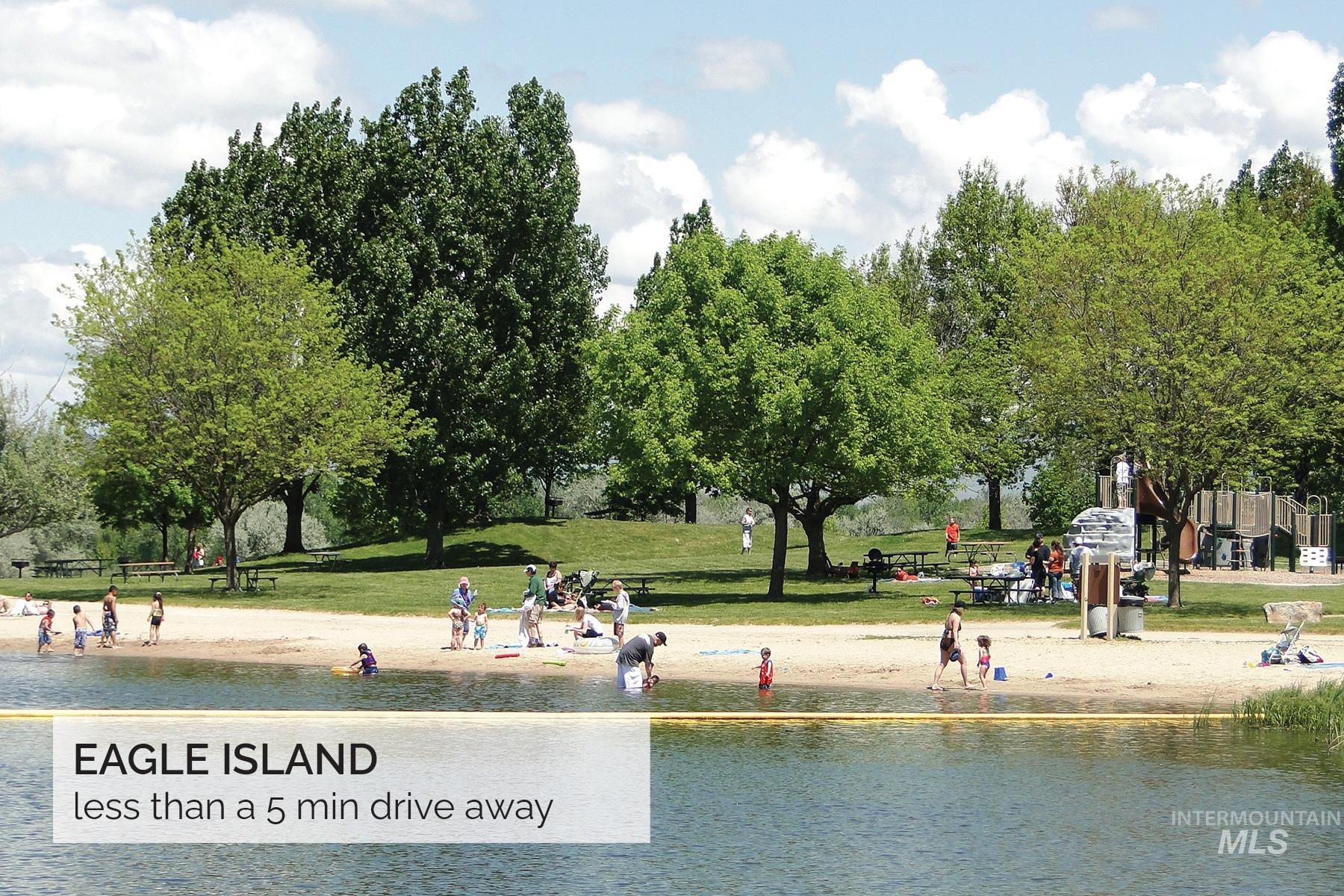 View of home's community with a water view and a lawn