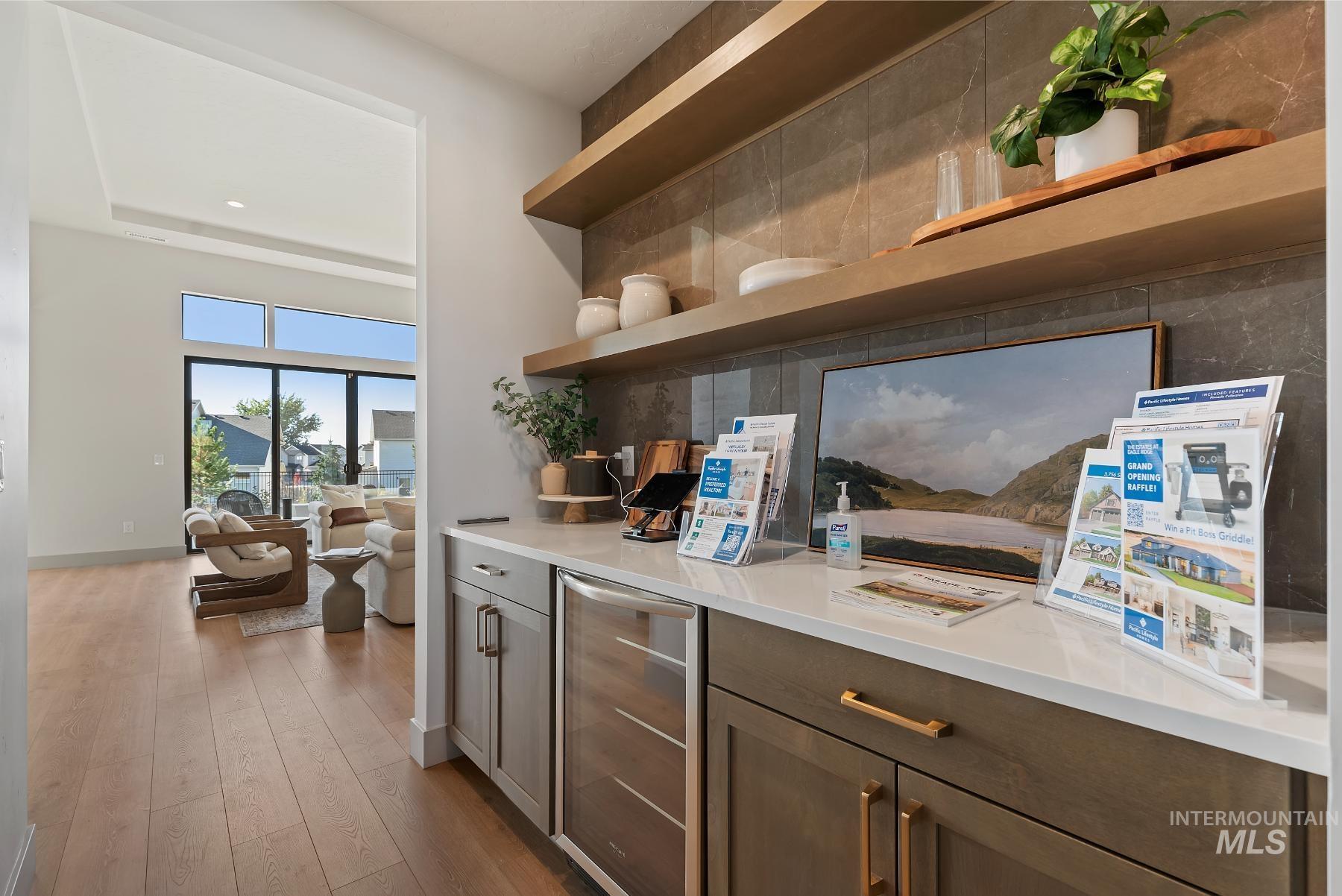 Kitchen with open shelves, wine cooler, light wood-style flooring, dark brown cabinetry, and recessed lighting