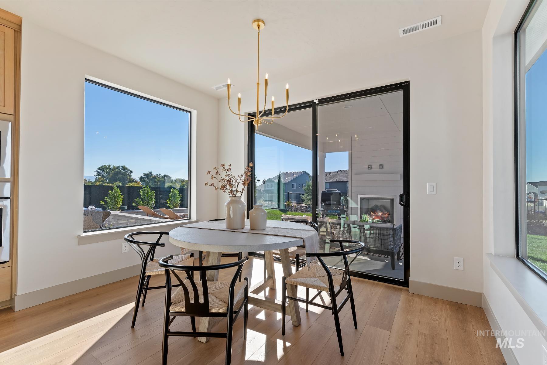 Dining area with a chandelier and healthy amount of natural light