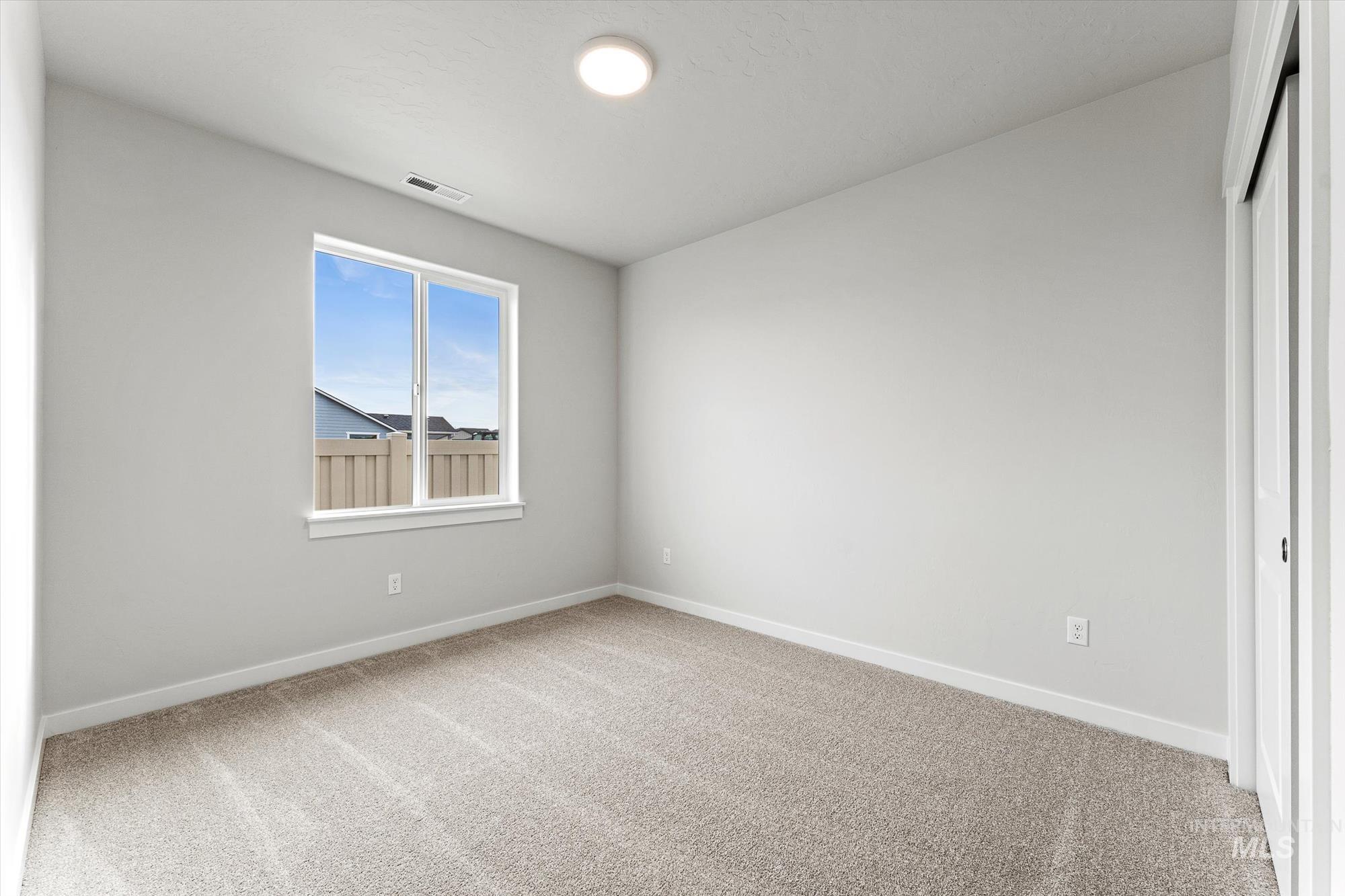 Unfurnished bedroom featuring carpet floors and a closet