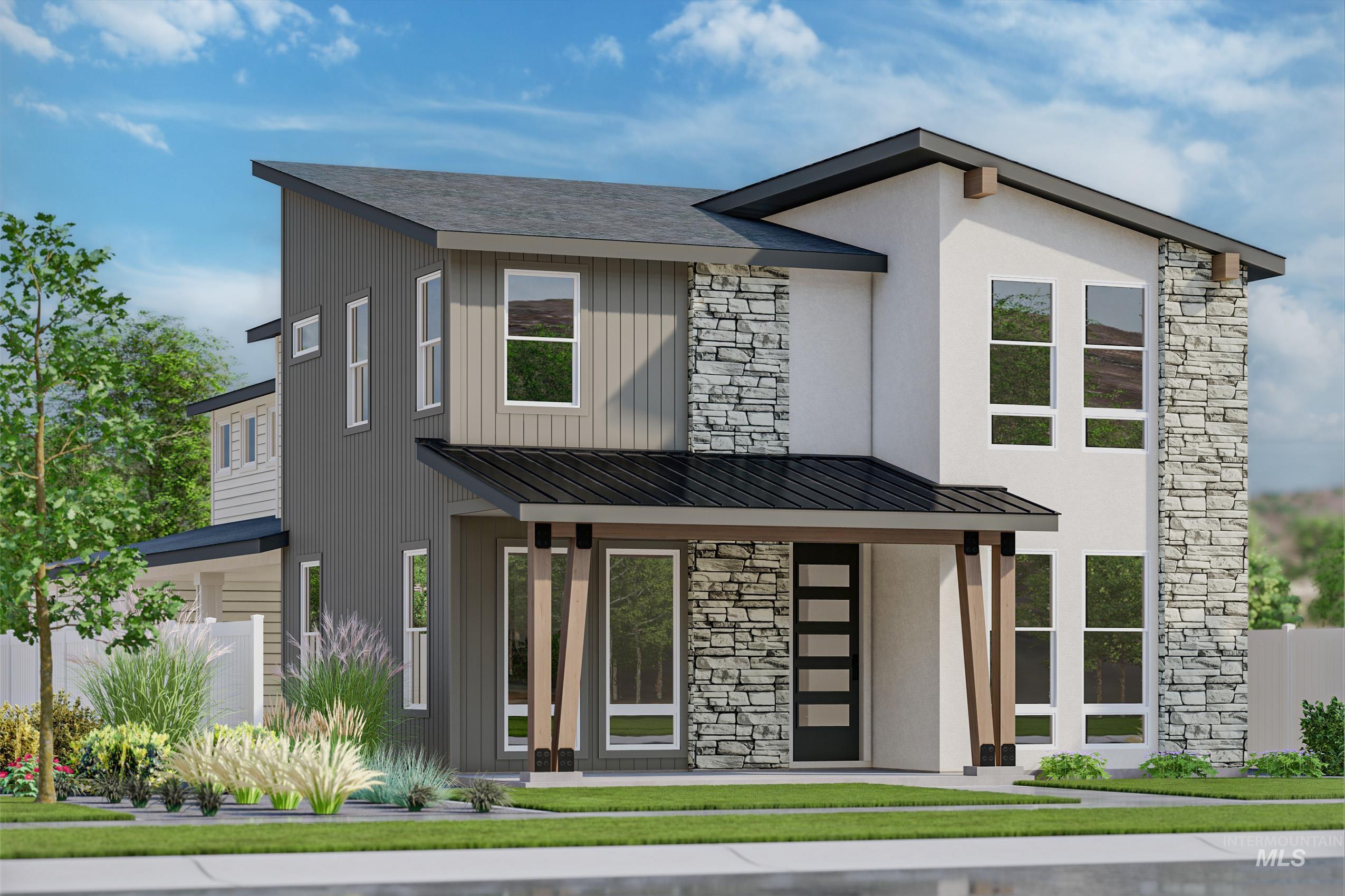 Contemporary home featuring stone siding, a standing seam roof, and a metal roof