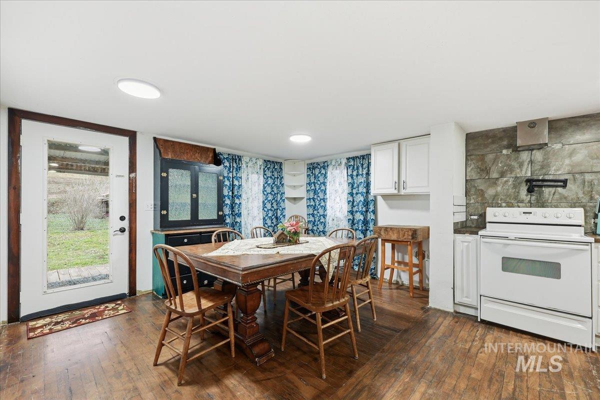 Dining room with dark wood finished floors