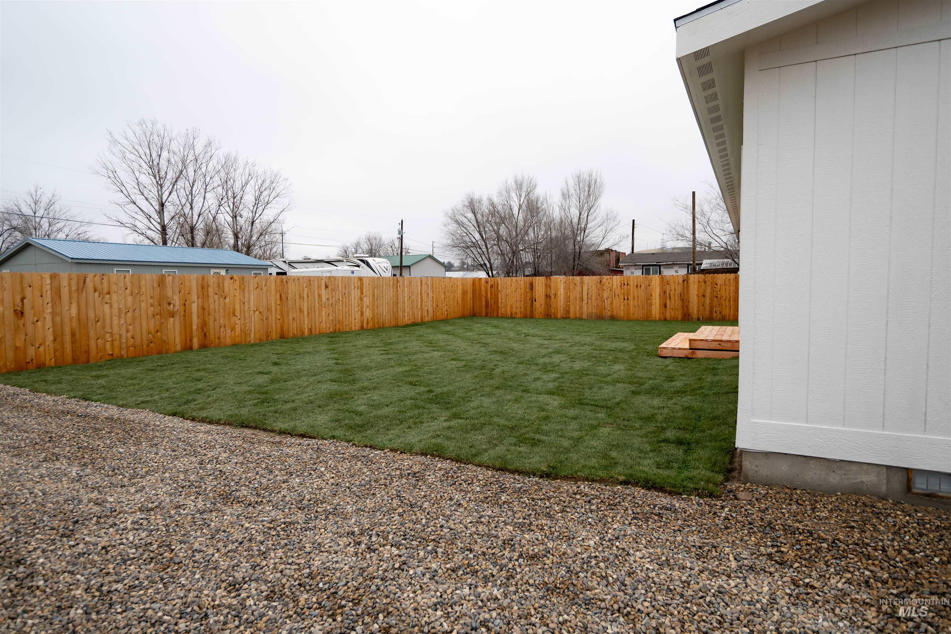 View of fenced backyard