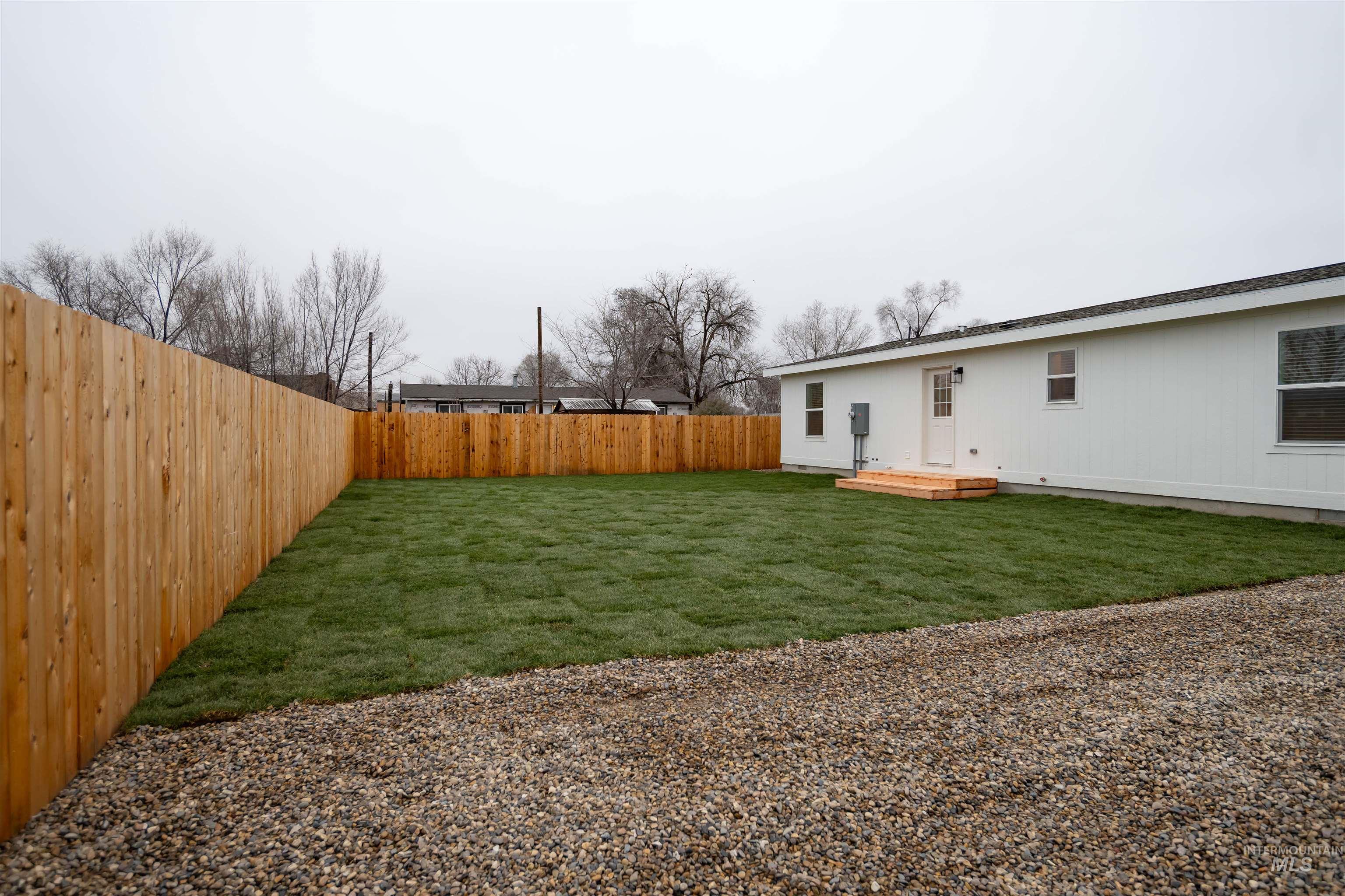 View of fenced backyard