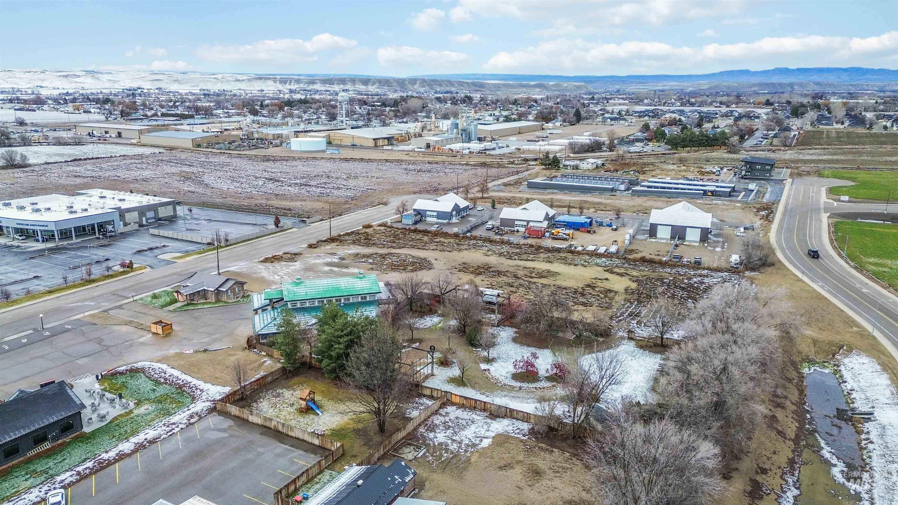 Aerial overview of property's location featuring an industrial area