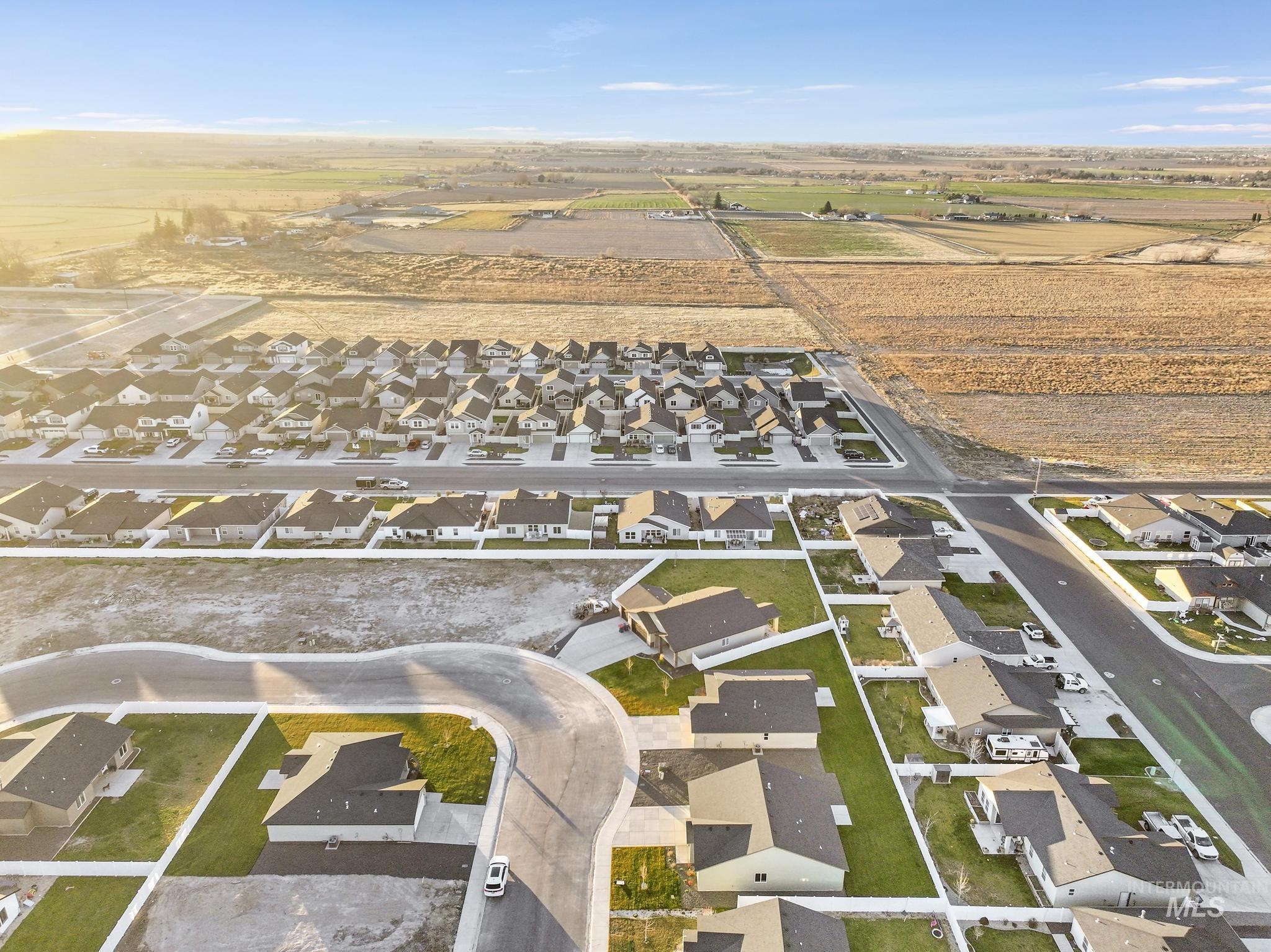 Aerial view of property's location featuring nearby suburban area