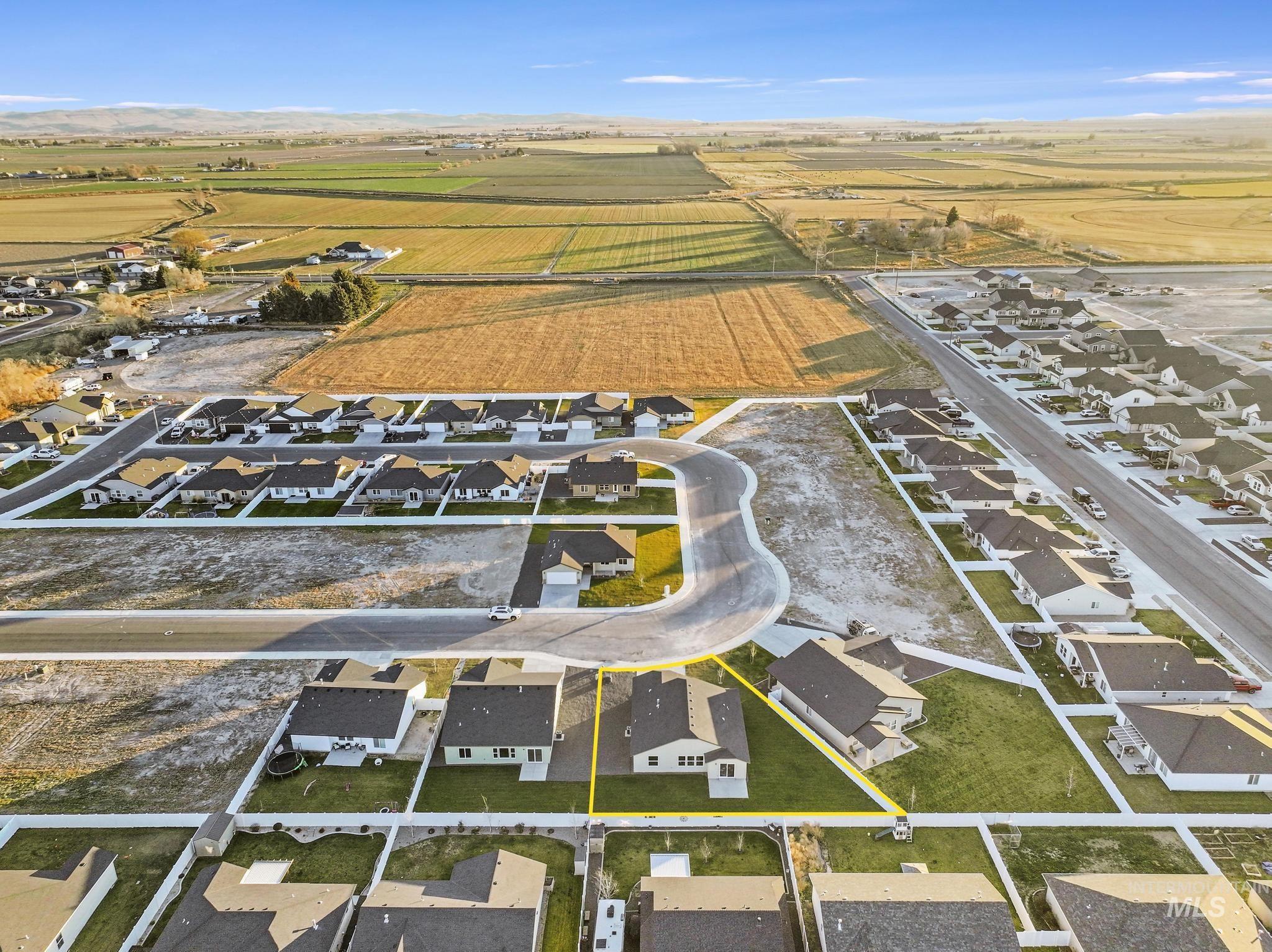 Aerial overview of property's location with nearby suburban area and rural landscape