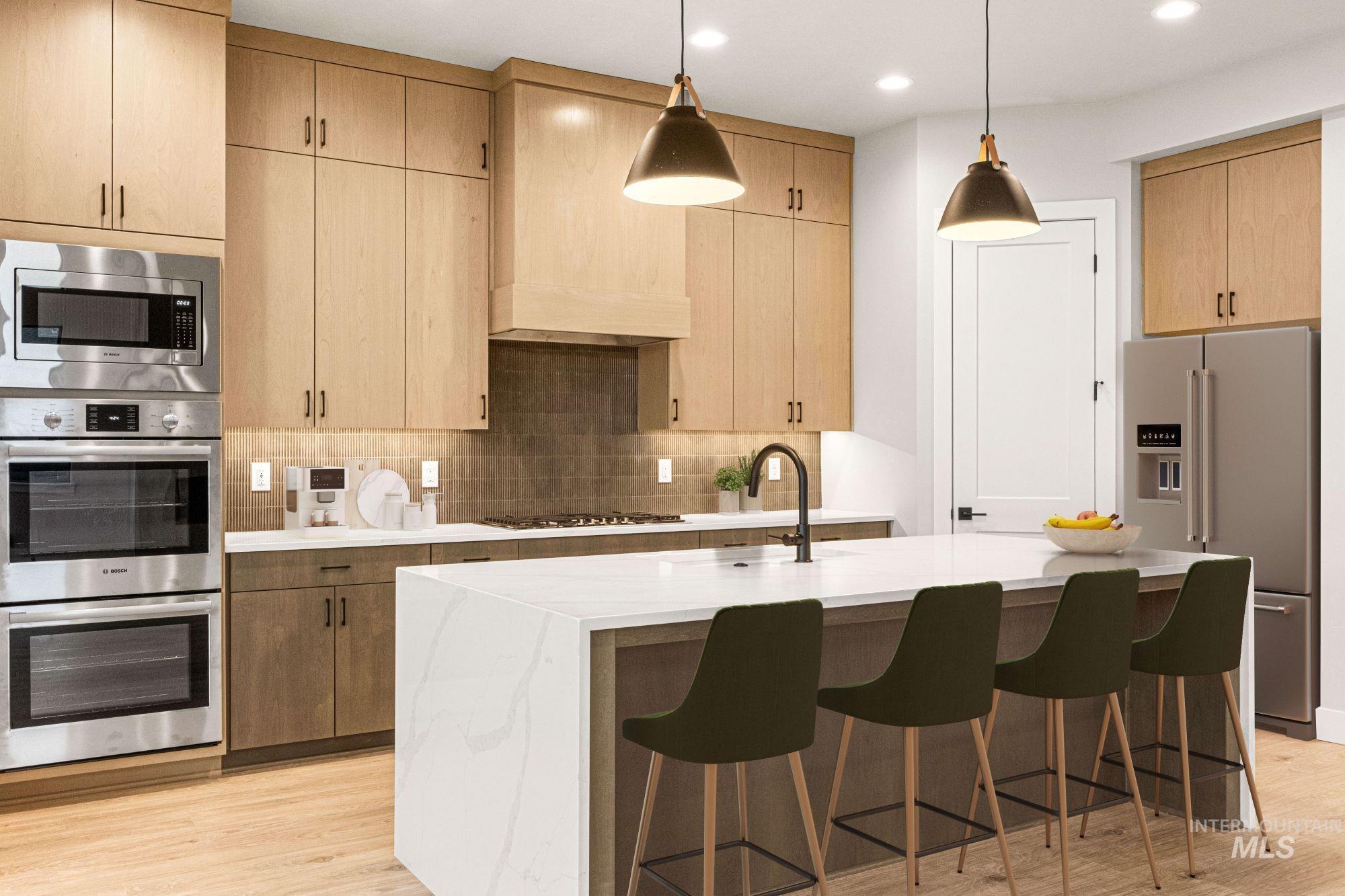 Kitchen with appliances with stainless steel finishes, pendant lighting, tasteful backsplash, premium range hood, and light stone countertops