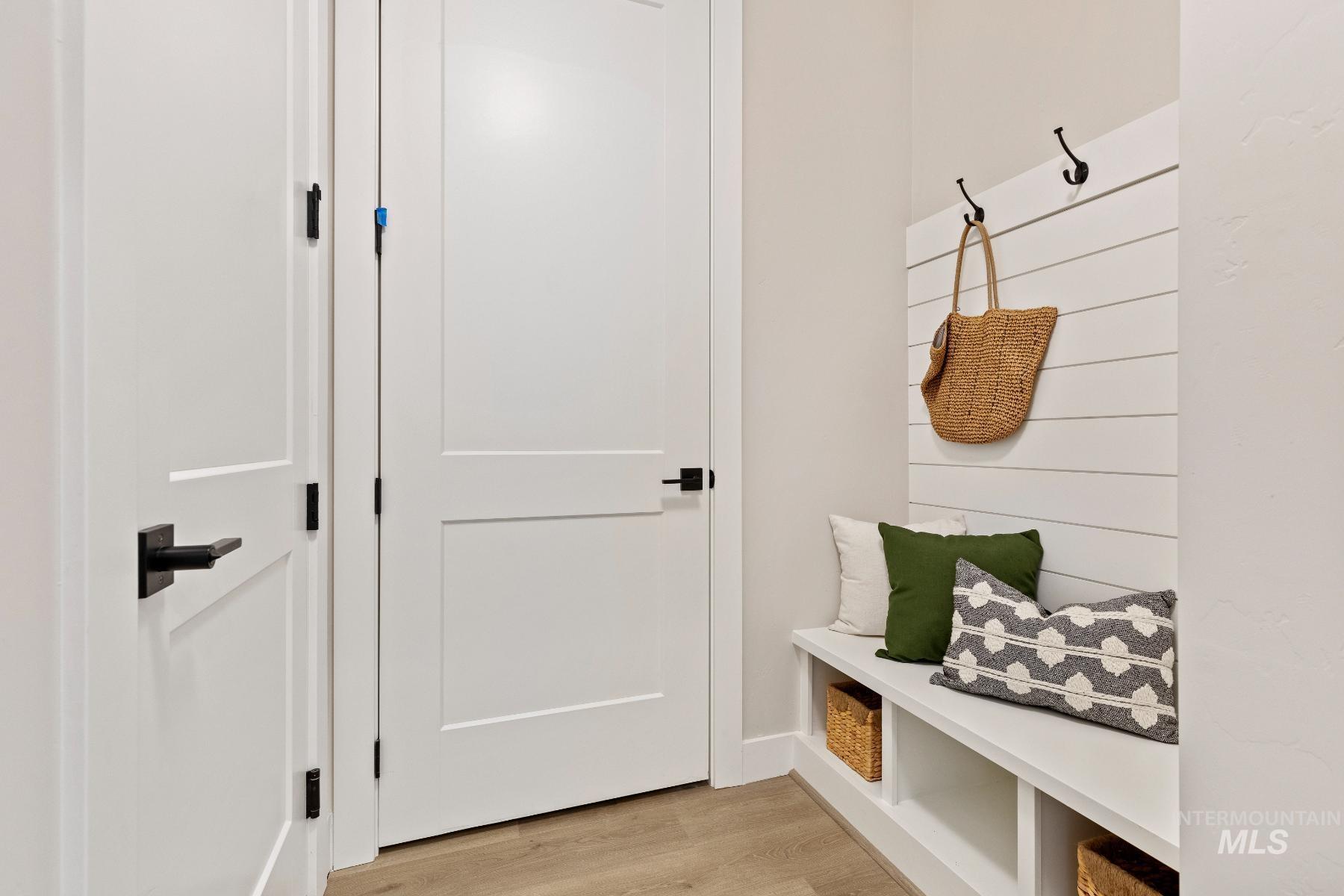 Mudroom featuring light wood finished floors