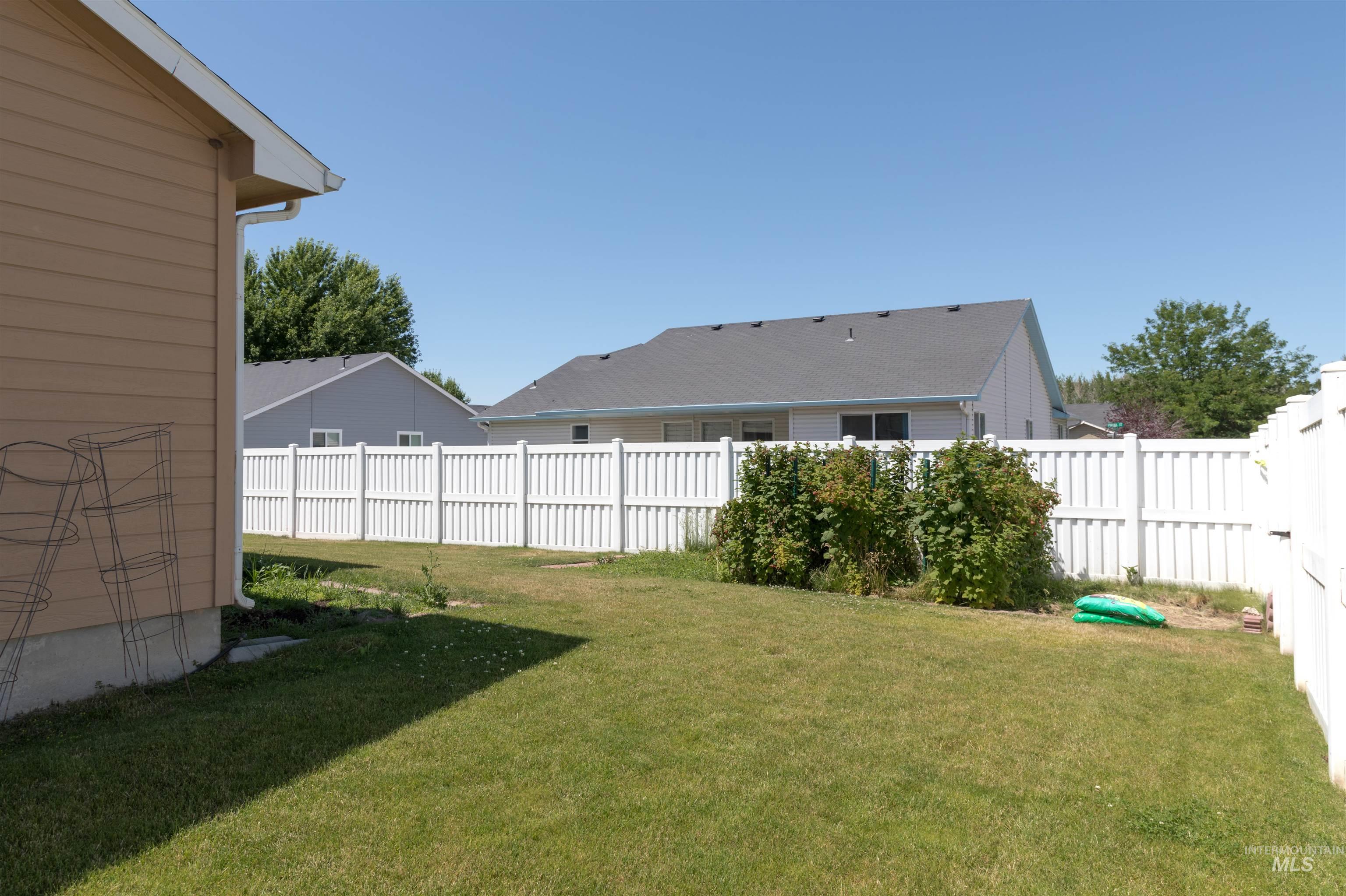 View of fenced backyard