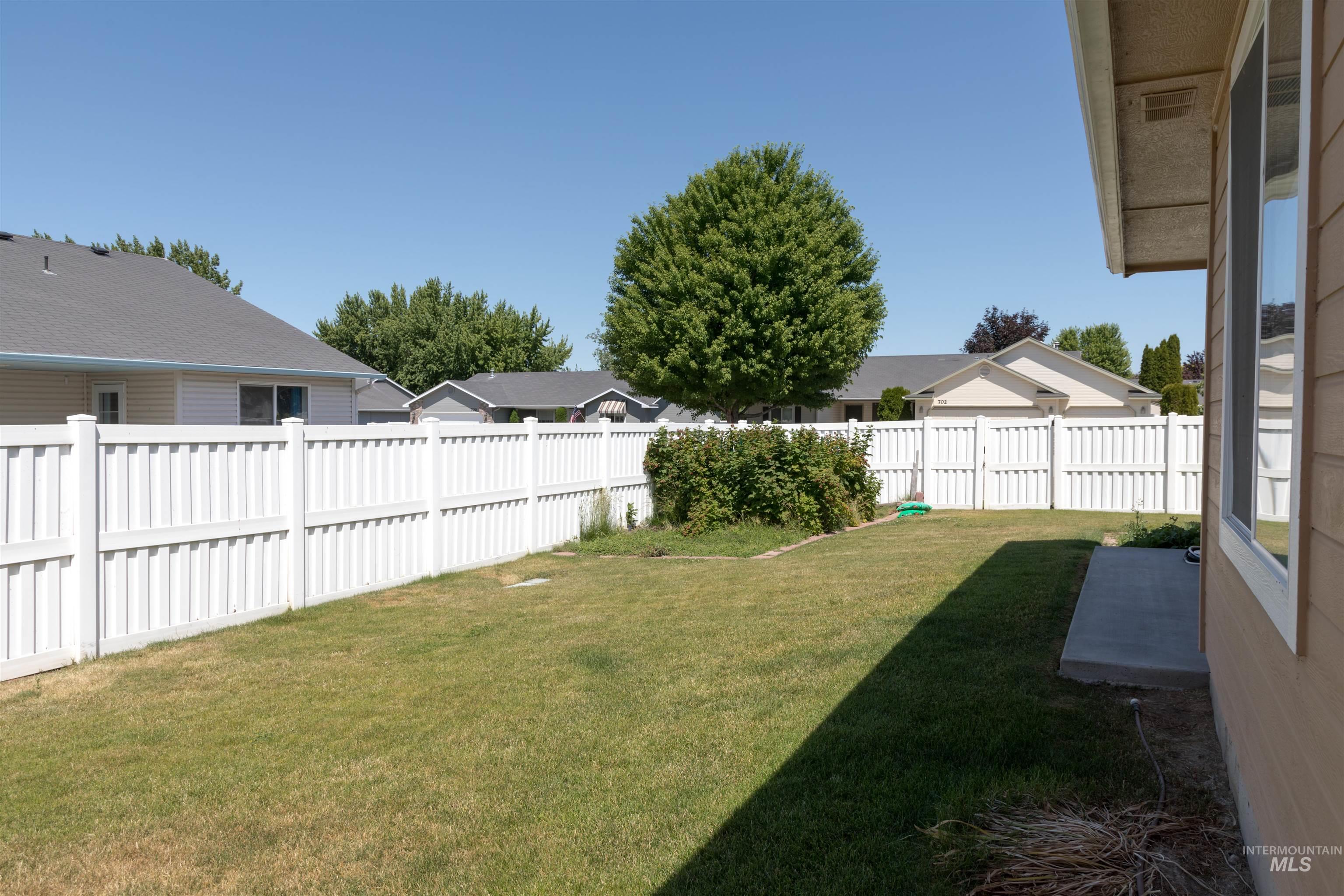 View of fenced backyard