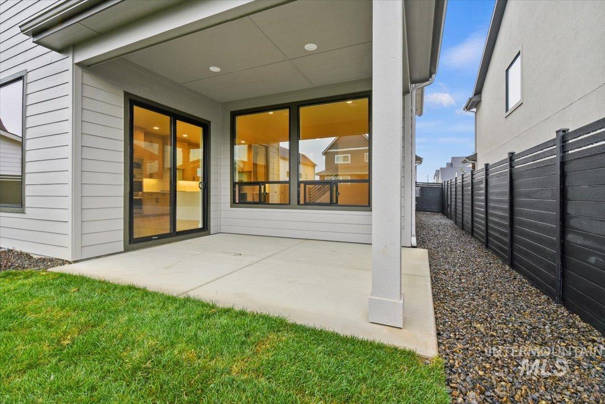 Fenced backyard featuring a patio area
