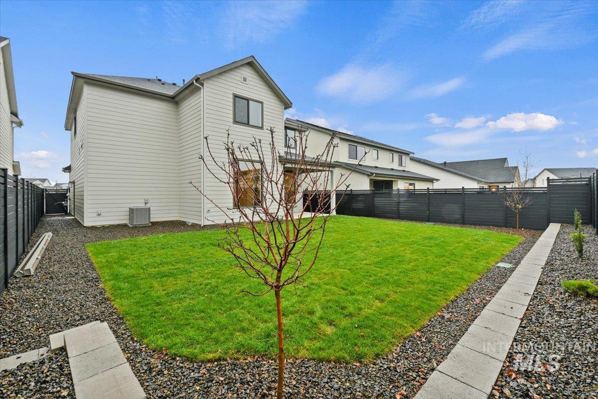 Back of house featuring a fenced backyard