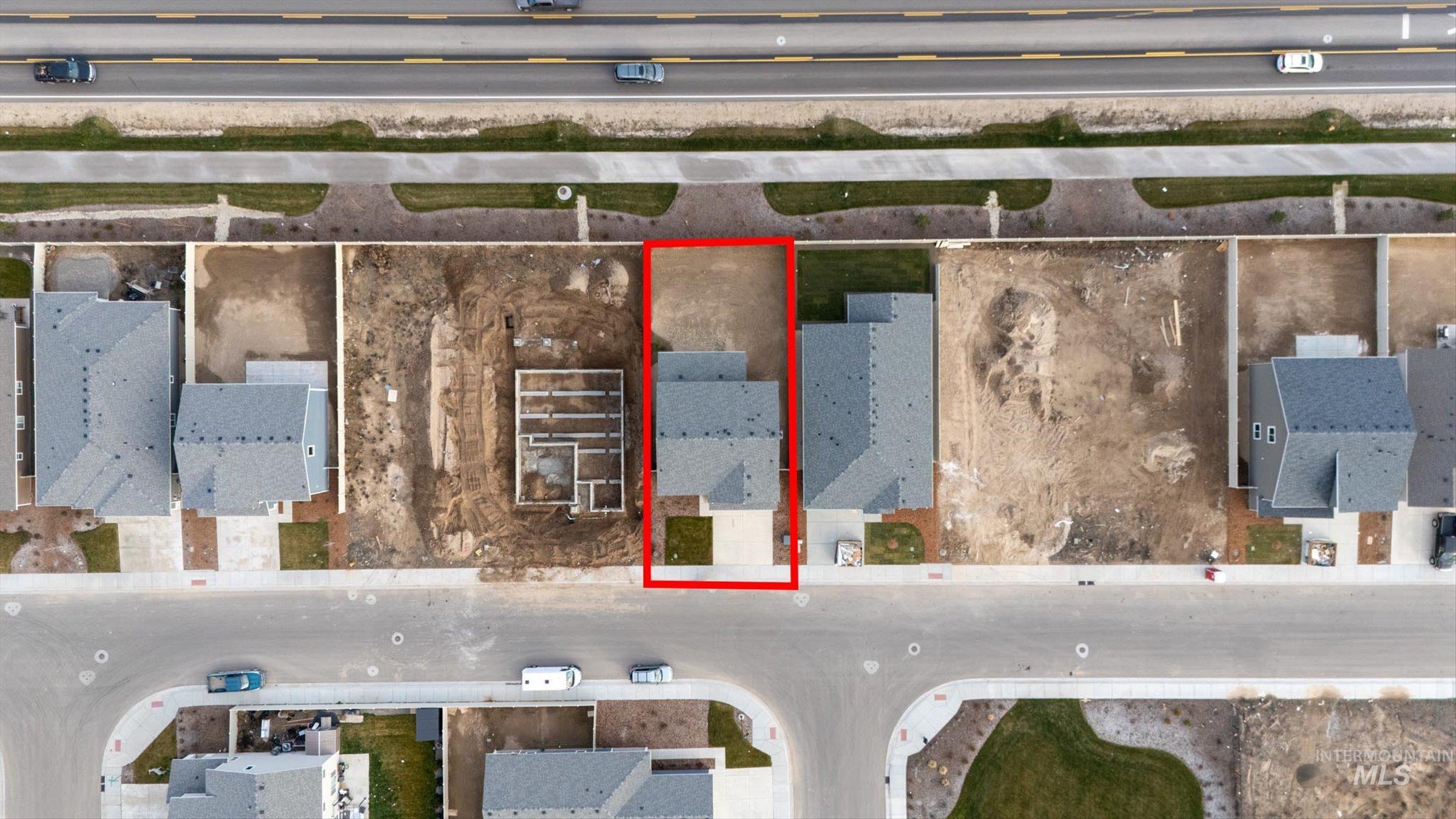 Aerial perspective of suburban area featuring property boundaries highlighted