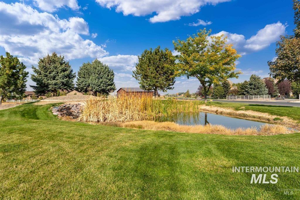 View of green lawn with a water view