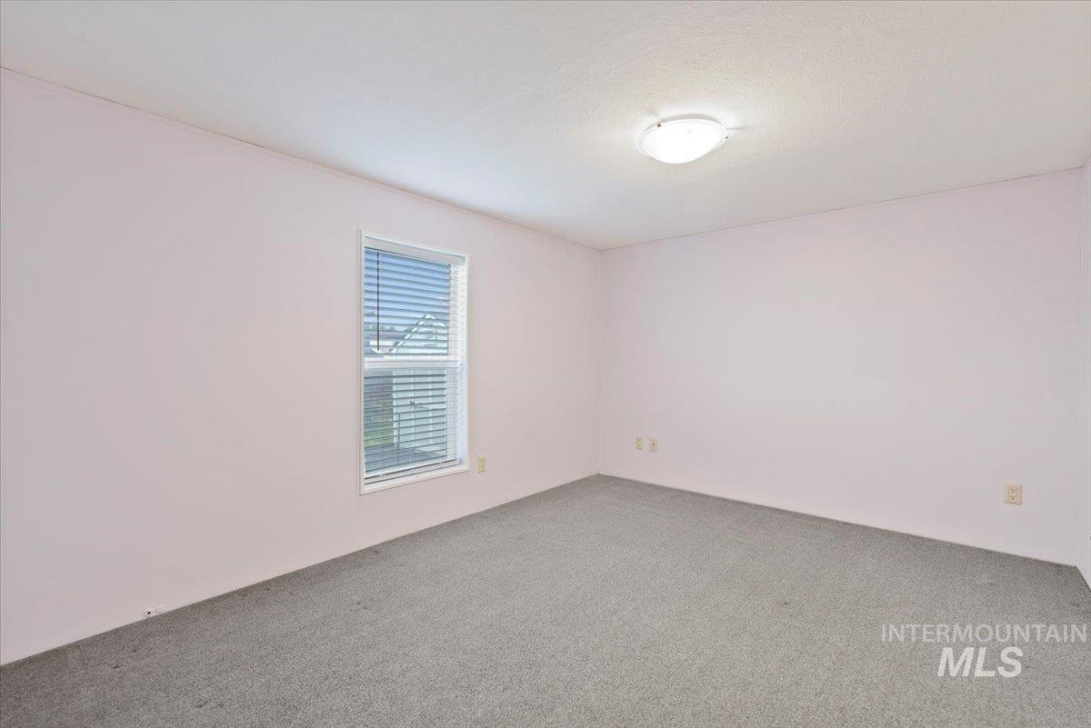 Spare room with carpet floors