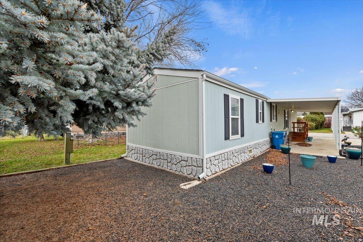 View of property exterior featuring crawl space and a patio