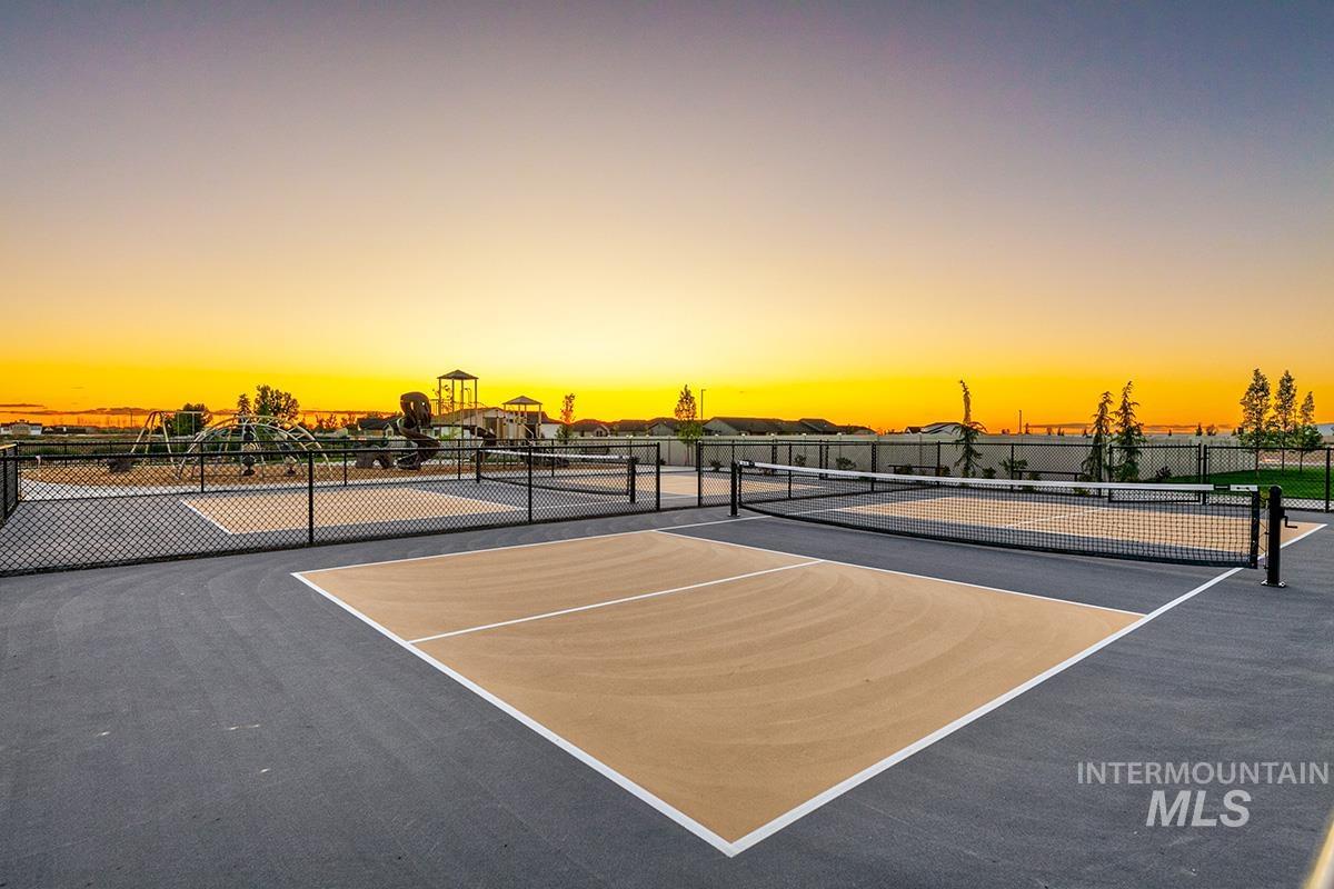 View of tennis court featuring community basketball court