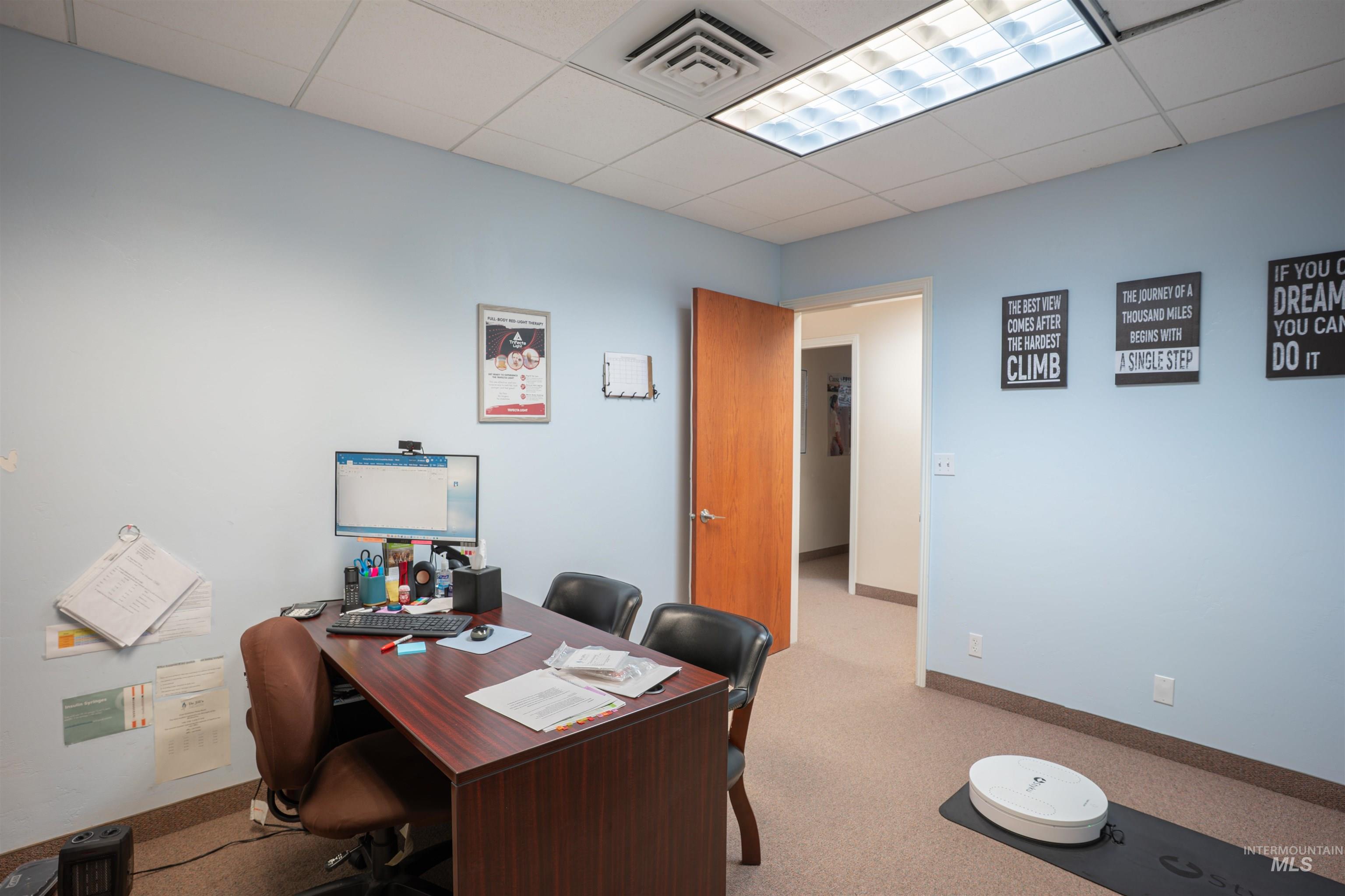 Office featuring a drop ceiling