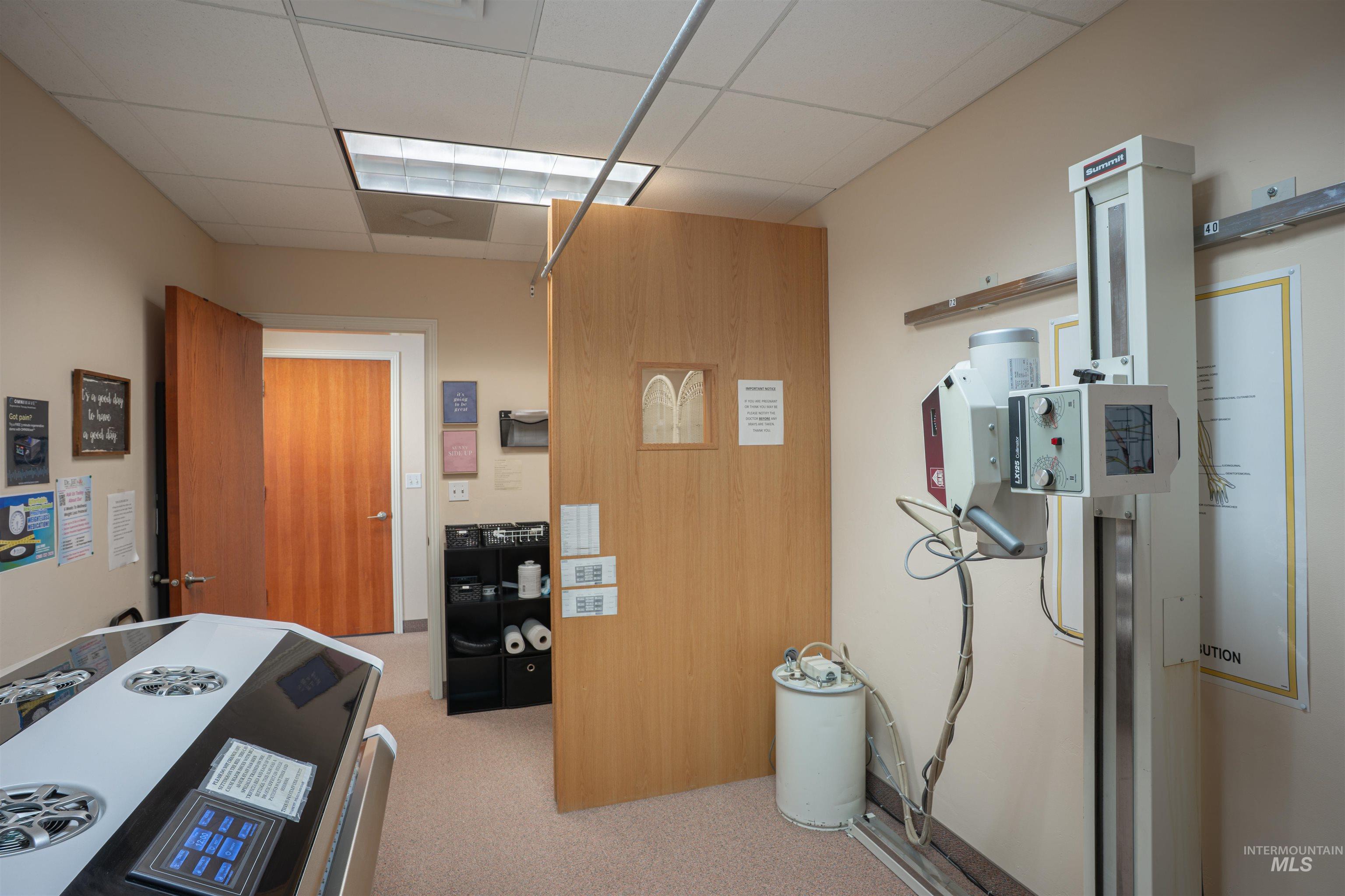 Office area featuring a paneled ceiling