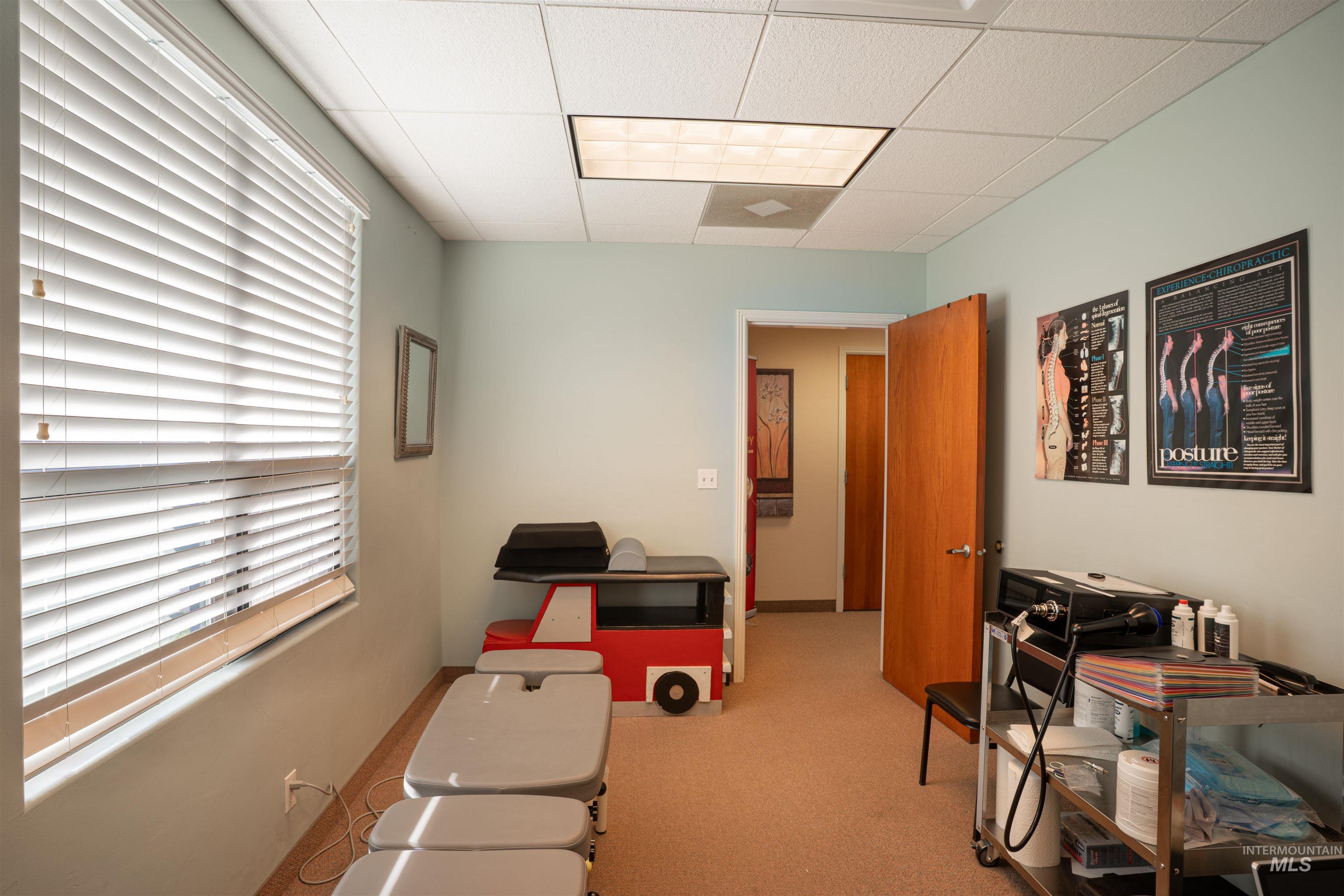 Office area with a paneled ceiling