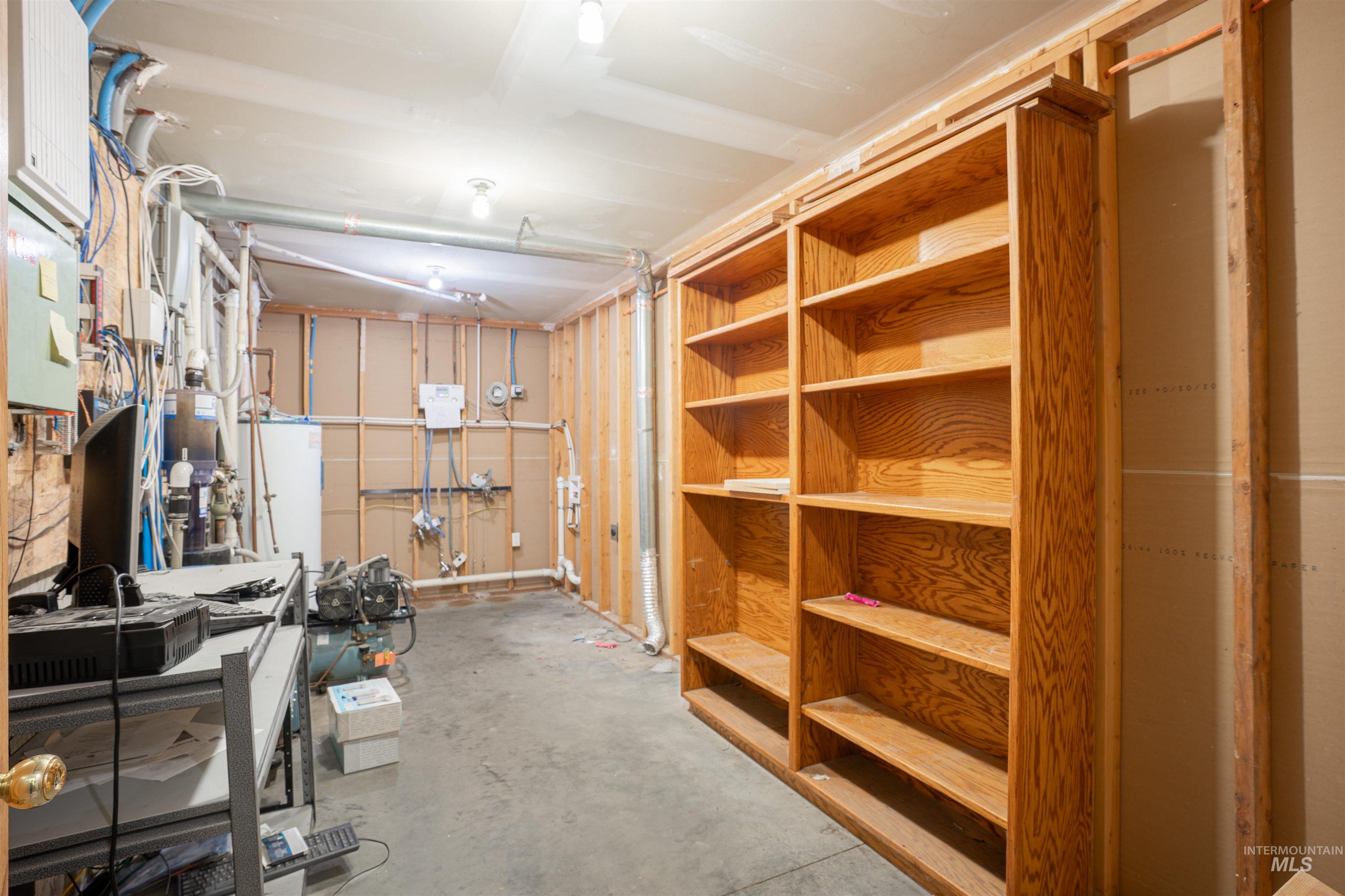 Storage room featuring water heater
