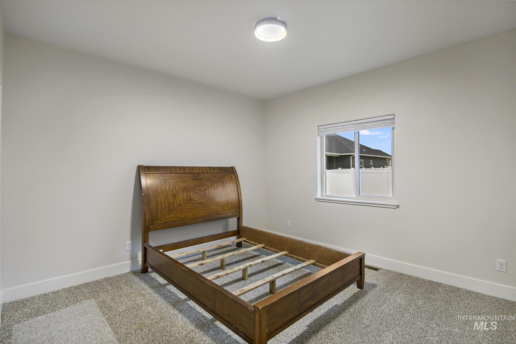Bedroom with carpet flooring
