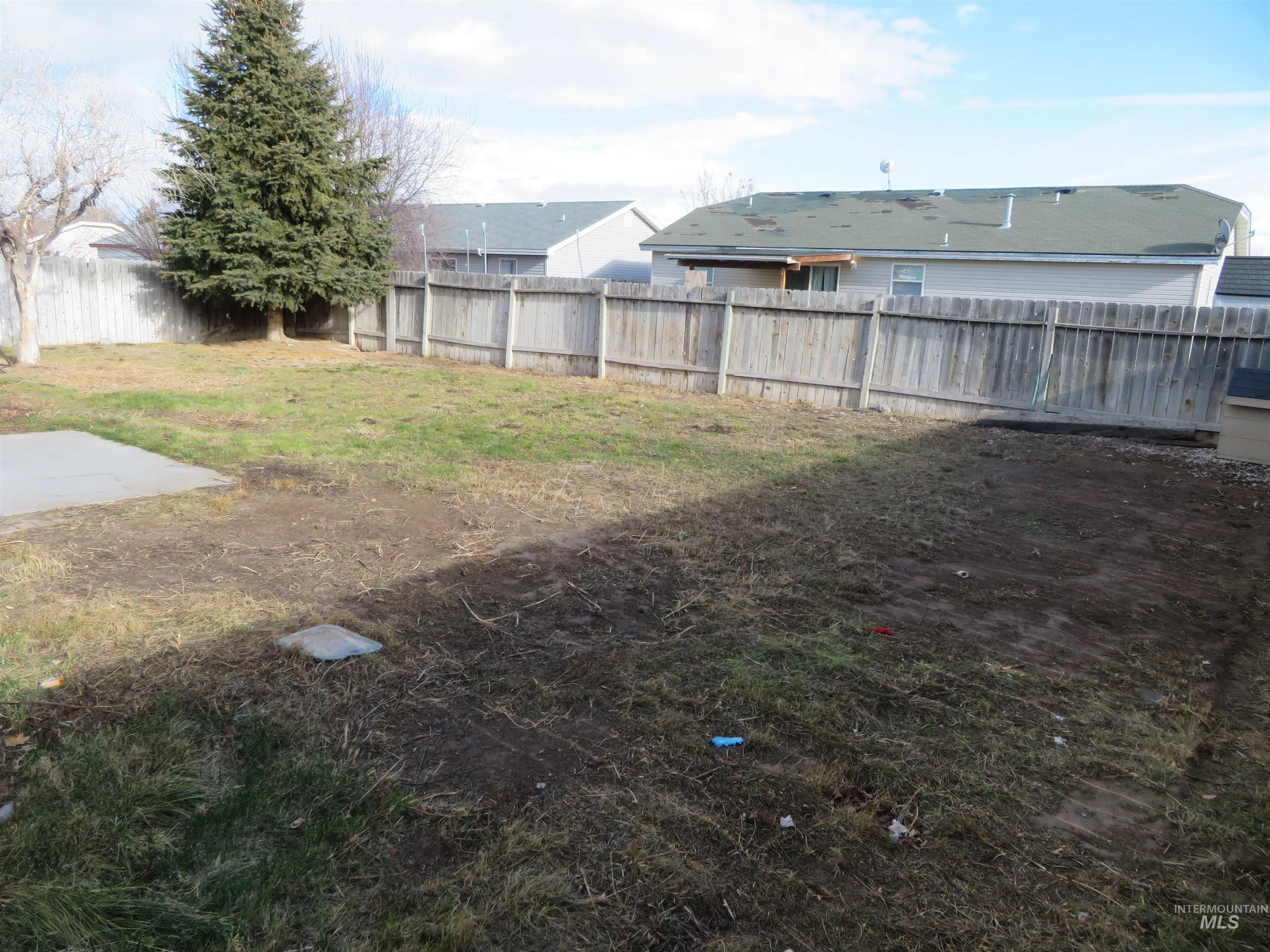 View of fenced backyard